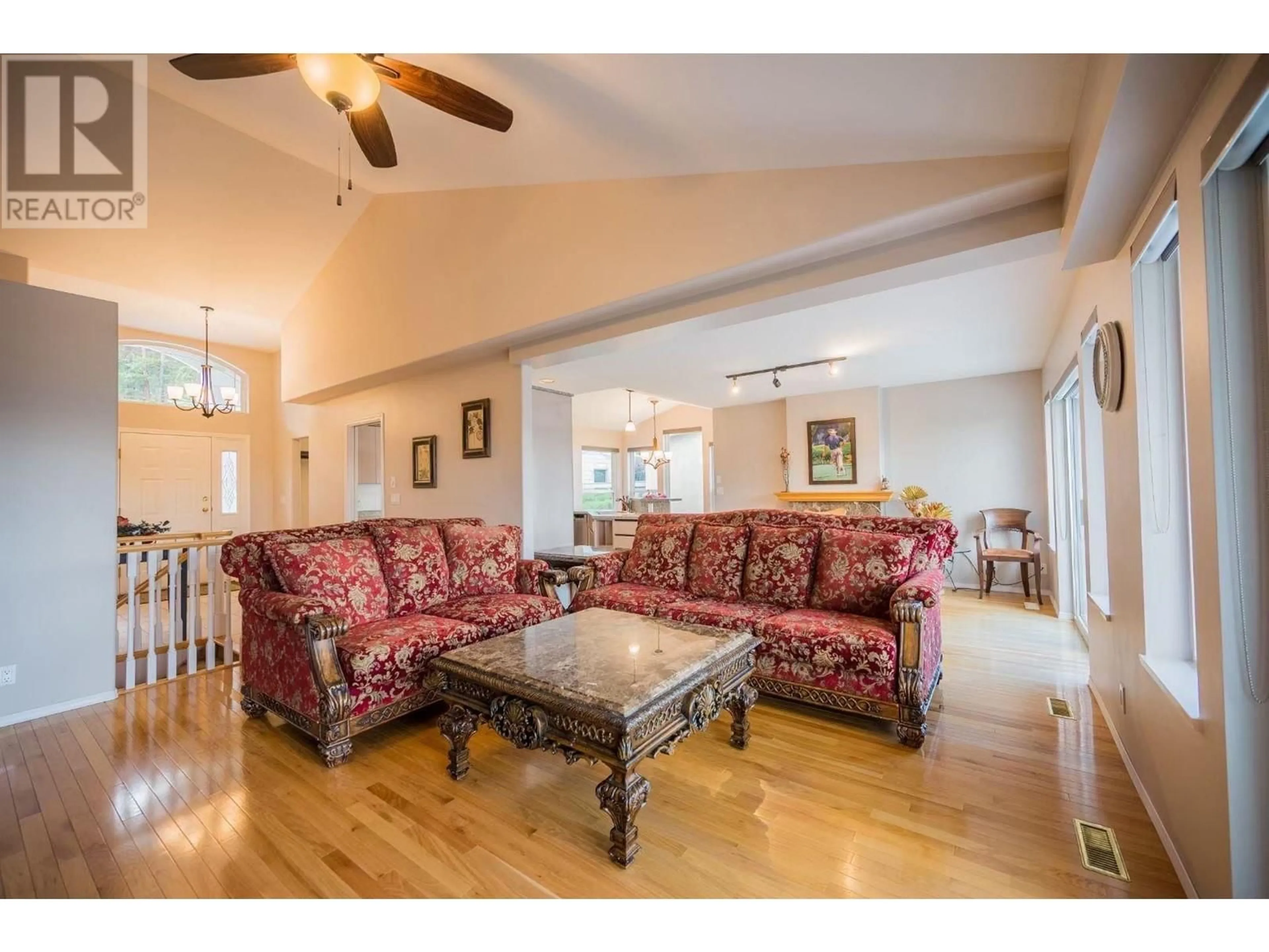 Living room with furniture, wood/laminate floor for 6261 THOMPSON DRIVE, Peachland British Columbia V0H1X8