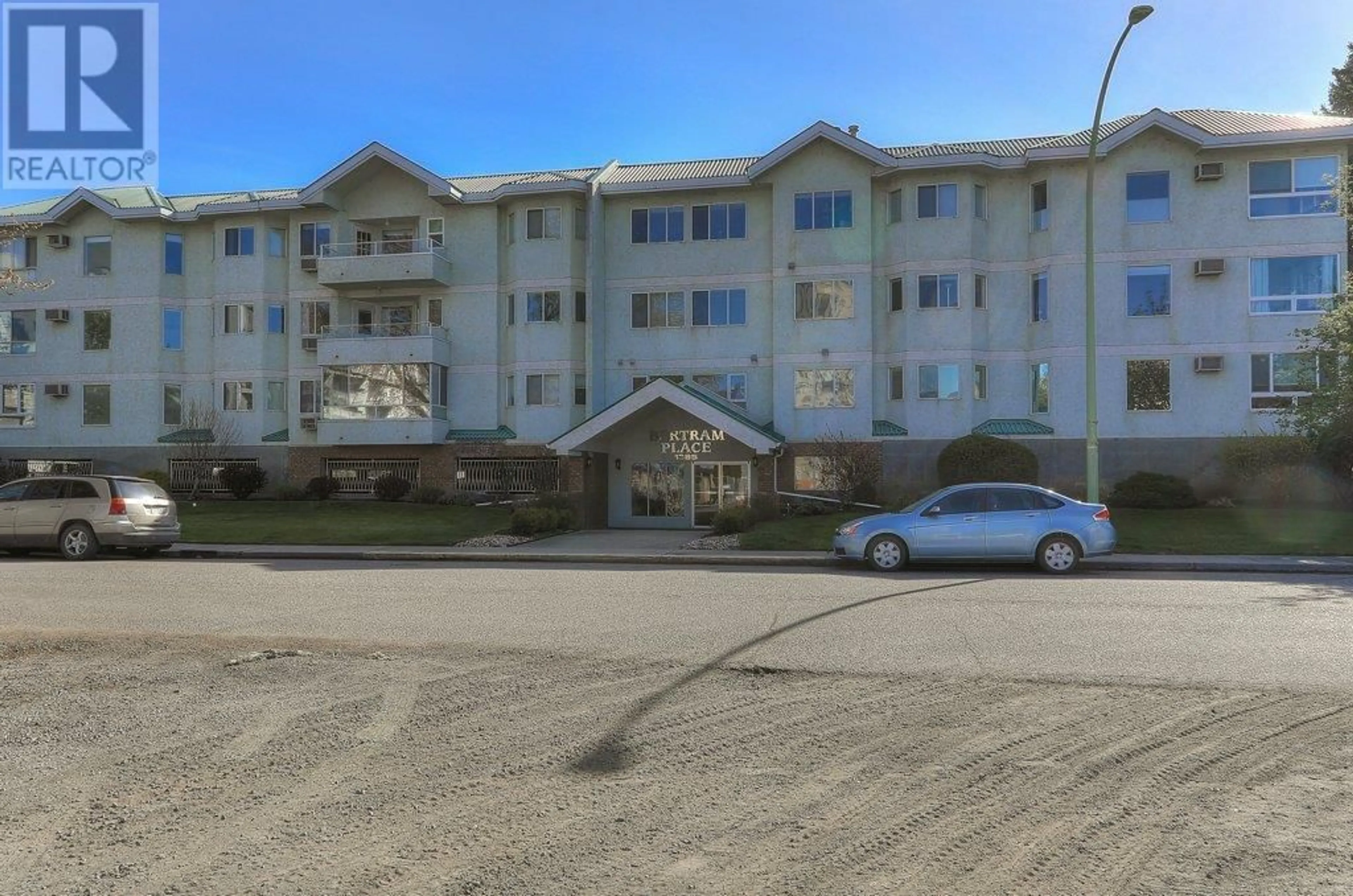 A pic from outside/outdoor area/front of a property/back of a property/a pic from drone, unknown for 1385 Bertram Street Unit# 201, Kelowna British Columbia V1Y2E9