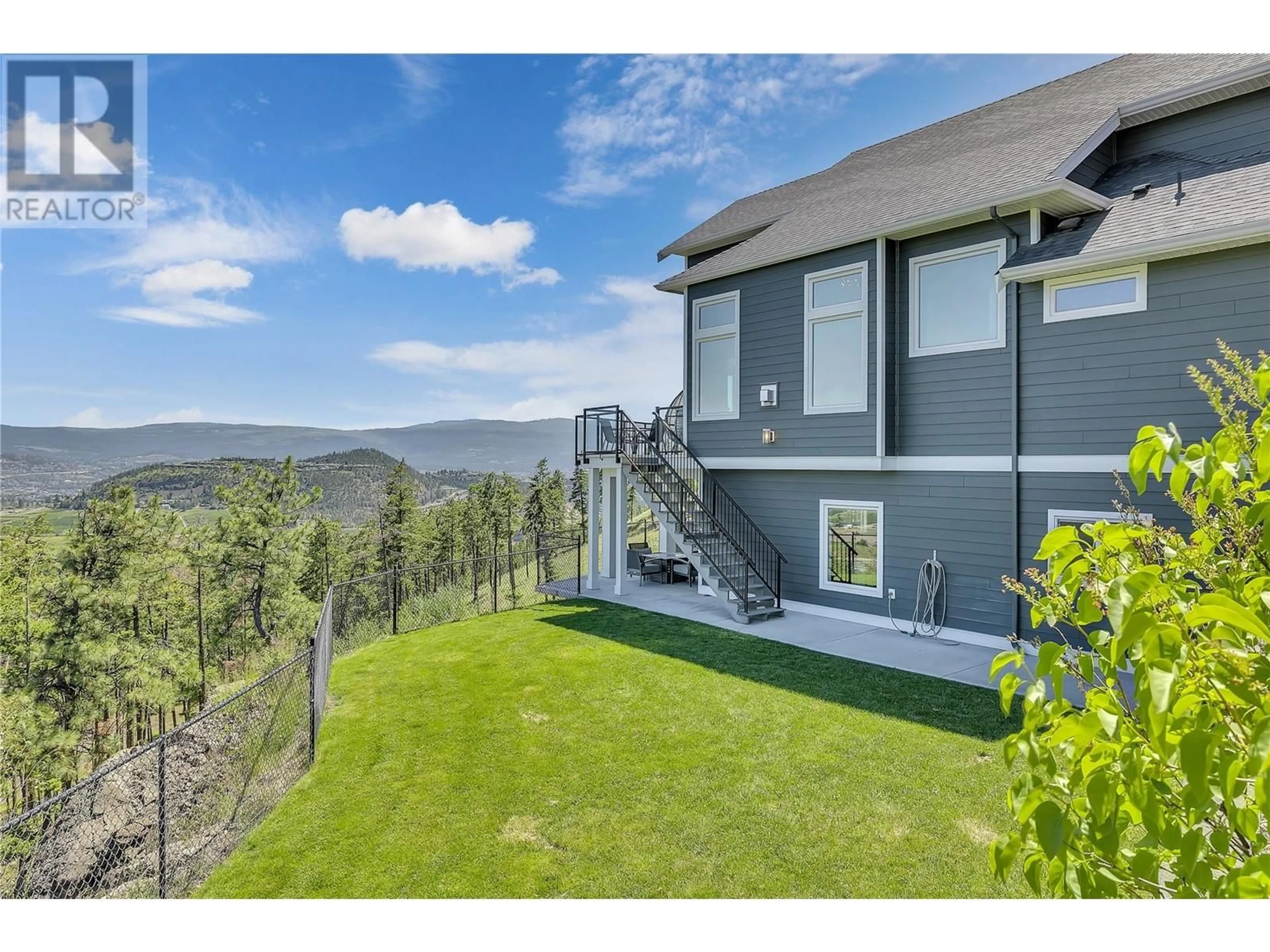 A pic from outside/outdoor area/front of a property/back of a property/a pic from drone, mountain view for 121 Upper Canyon Drive N, Kelowna British Columbia V1V3C5