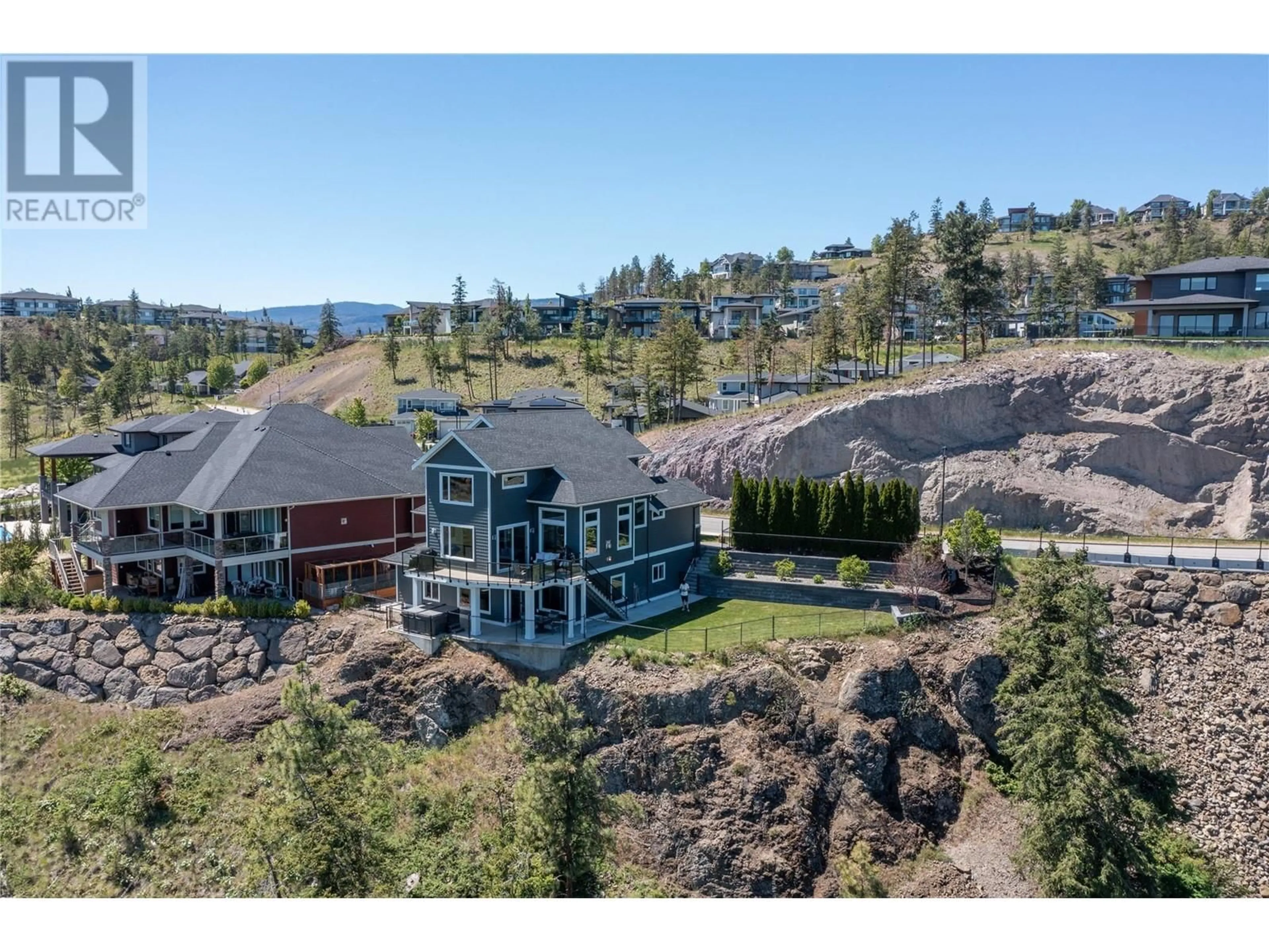 A pic from outside/outdoor area/front of a property/back of a property/a pic from drone, mountain view for 121 Upper Canyon Drive N, Kelowna British Columbia V1V3C5