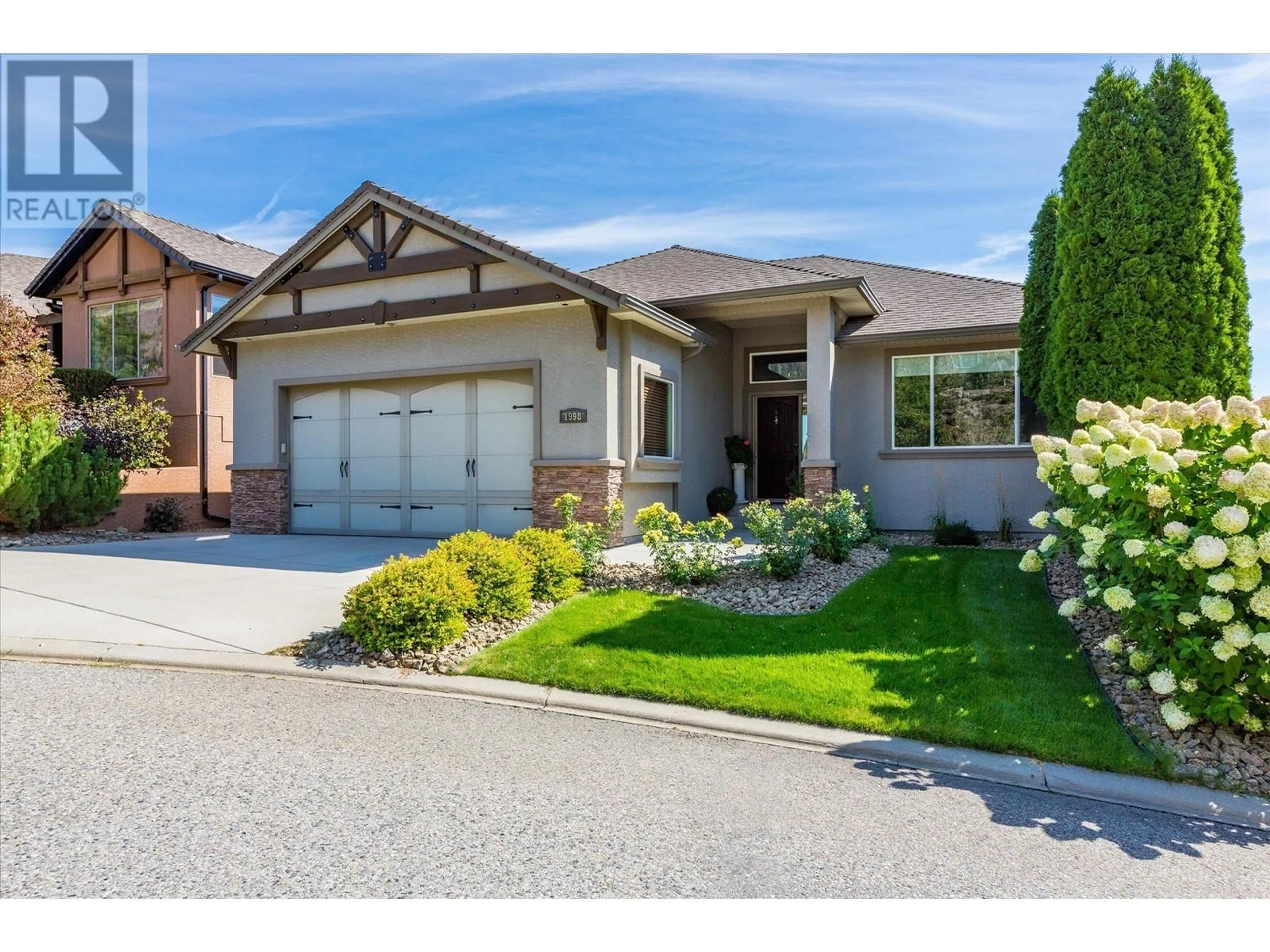 Home with brick exterior material, street for 1998 Cornerstone Drive, West Kelowna British Columbia V4T2Y3