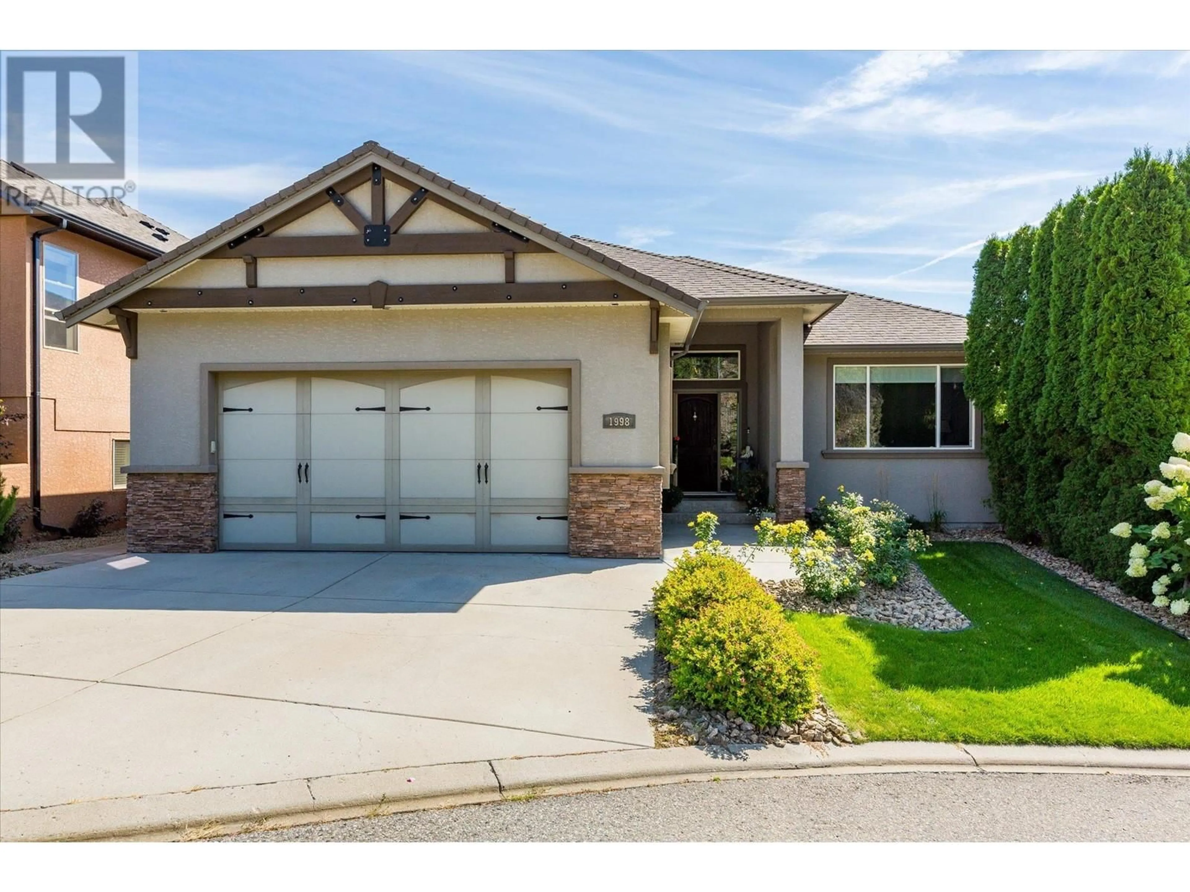 Home with brick exterior material, street for 1998 Cornerstone Drive, West Kelowna British Columbia V4T2Y3