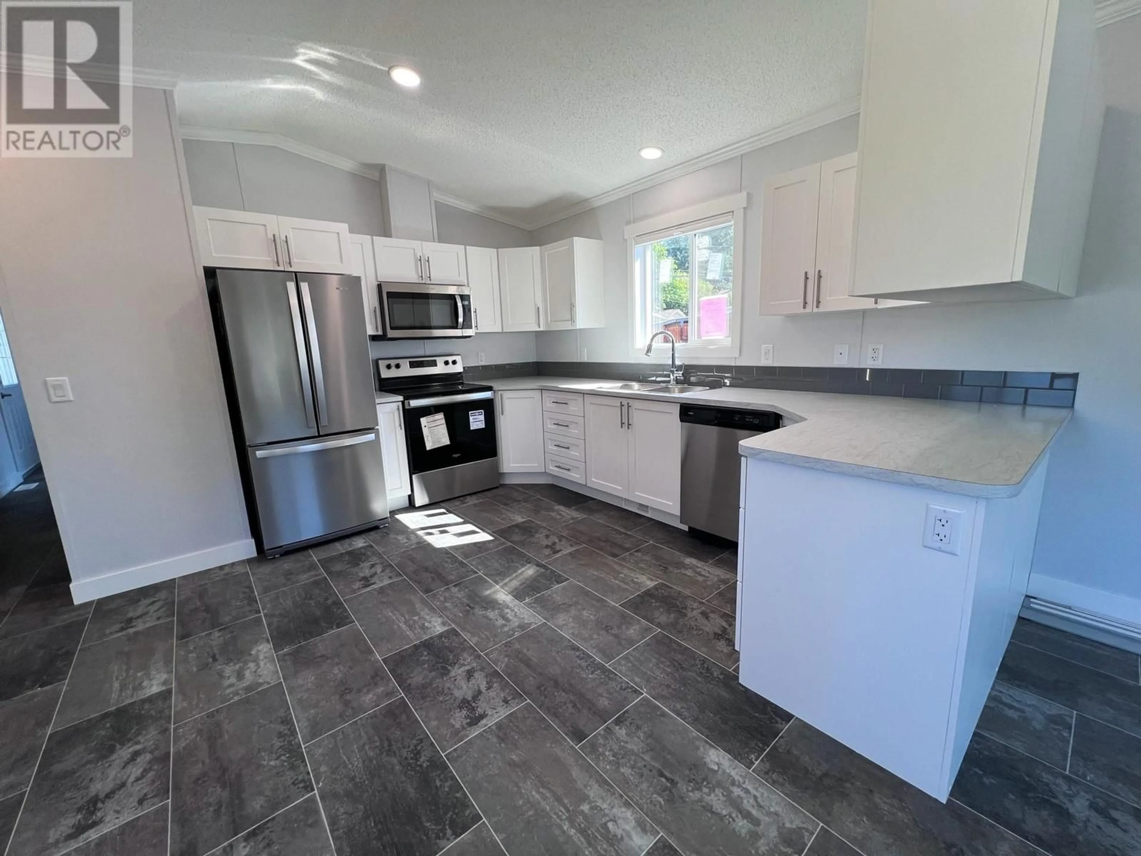 Open concept kitchen, ceramic/tile floor for 406 Brandlmayr Gate Unit# 45, Princeton British Columbia V0X1W0