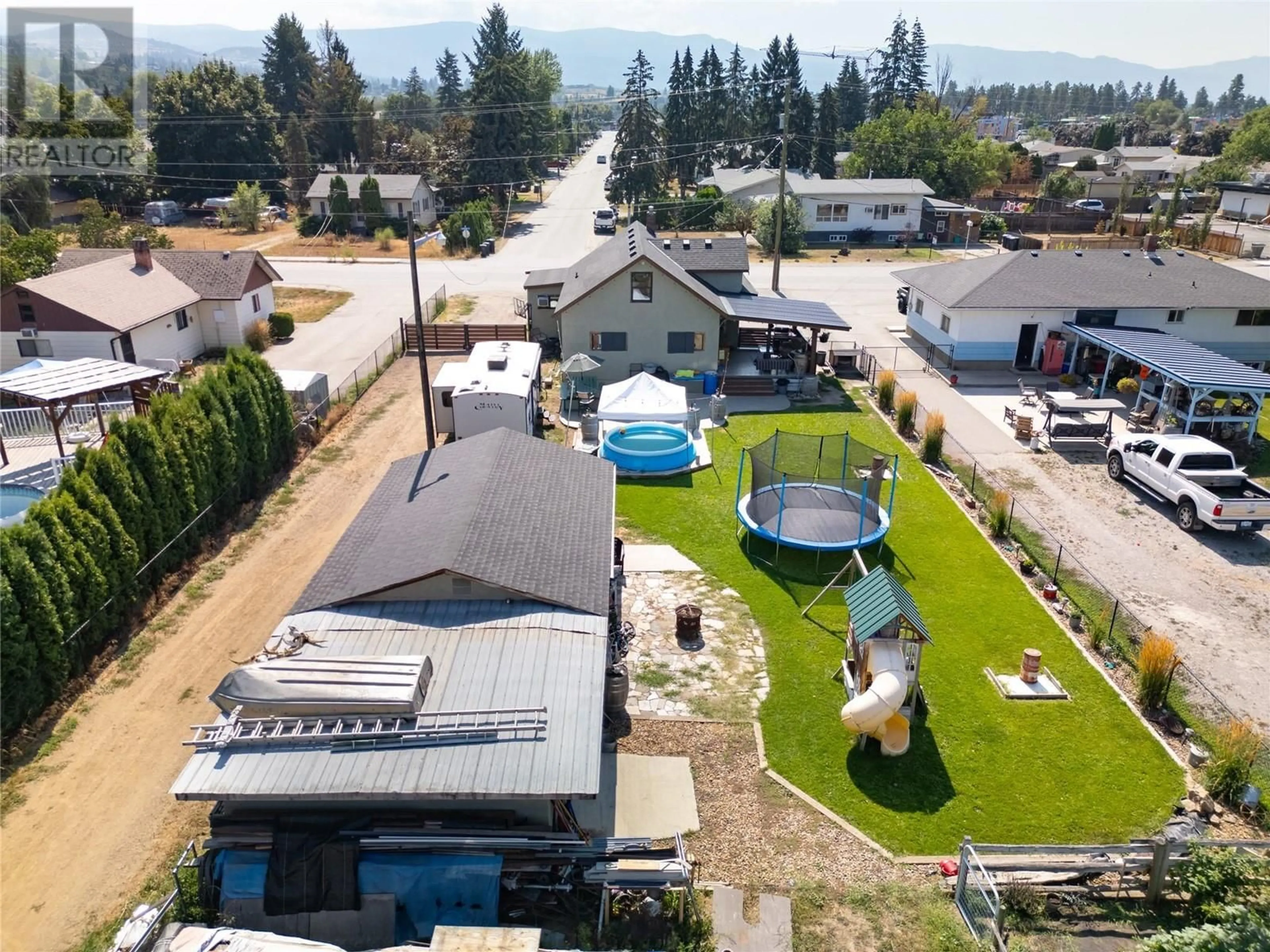 A pic from outside/outdoor area/front of a property/back of a property/a pic from drone, unknown for 170 Mugford Road, Kelowna British Columbia V1X2E2