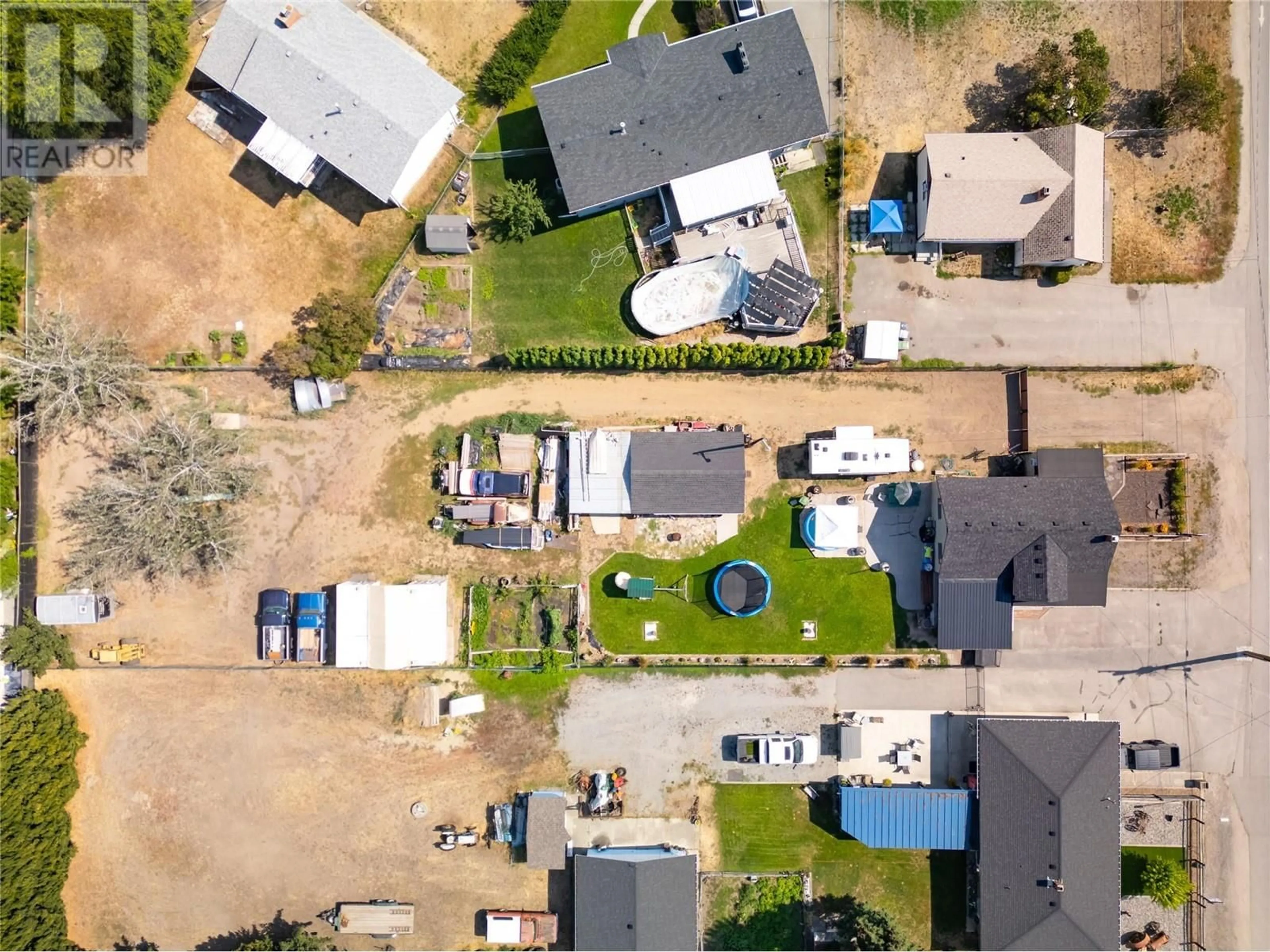 A pic from outside/outdoor area/front of a property/back of a property/a pic from drone, street for 170 Mugford Road, Kelowna British Columbia V1X2E2