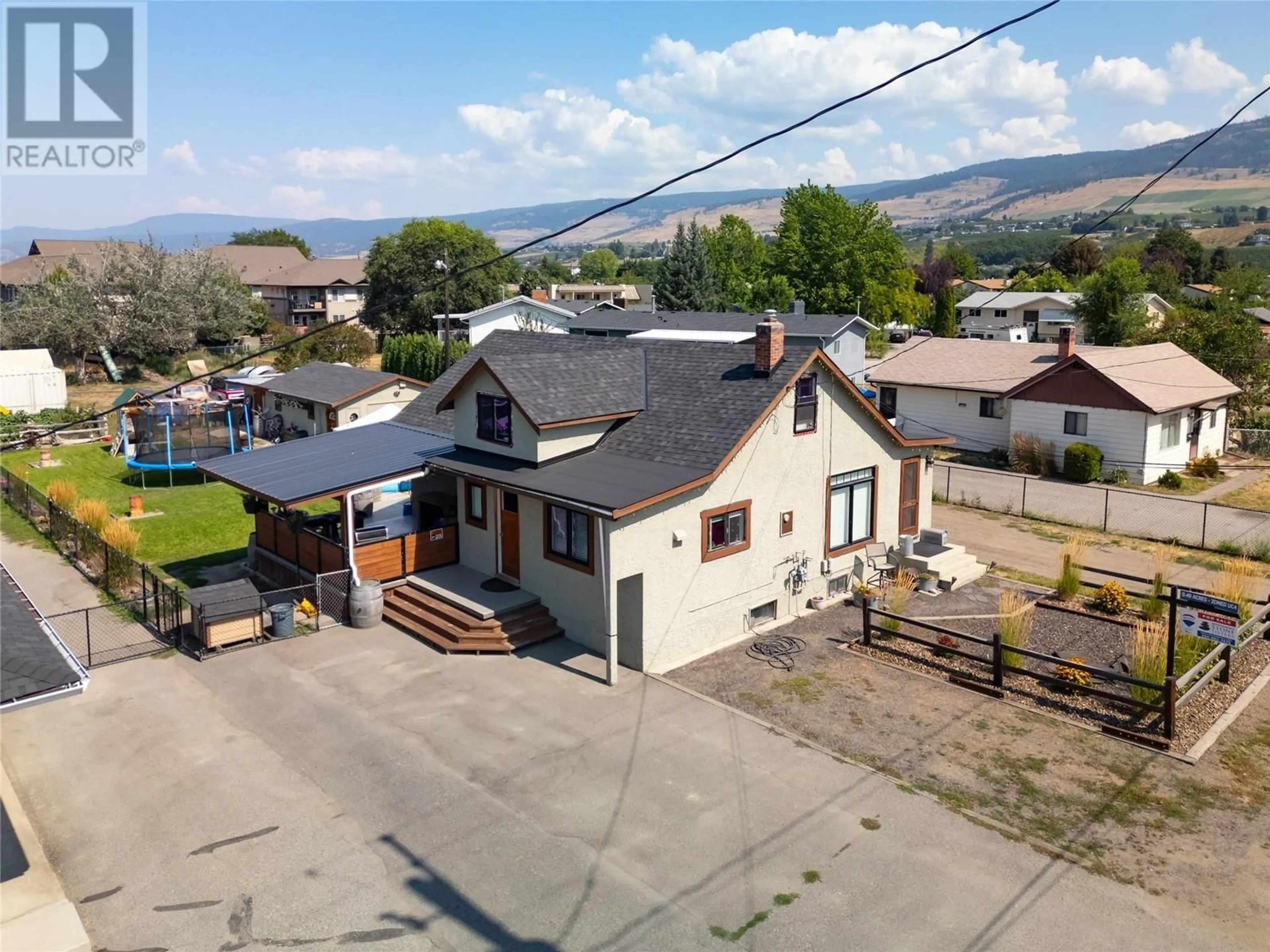 A pic from outside/outdoor area/front of a property/back of a property/a pic from drone, mountain view for 170 Mugford Road, Kelowna British Columbia V1X2E2