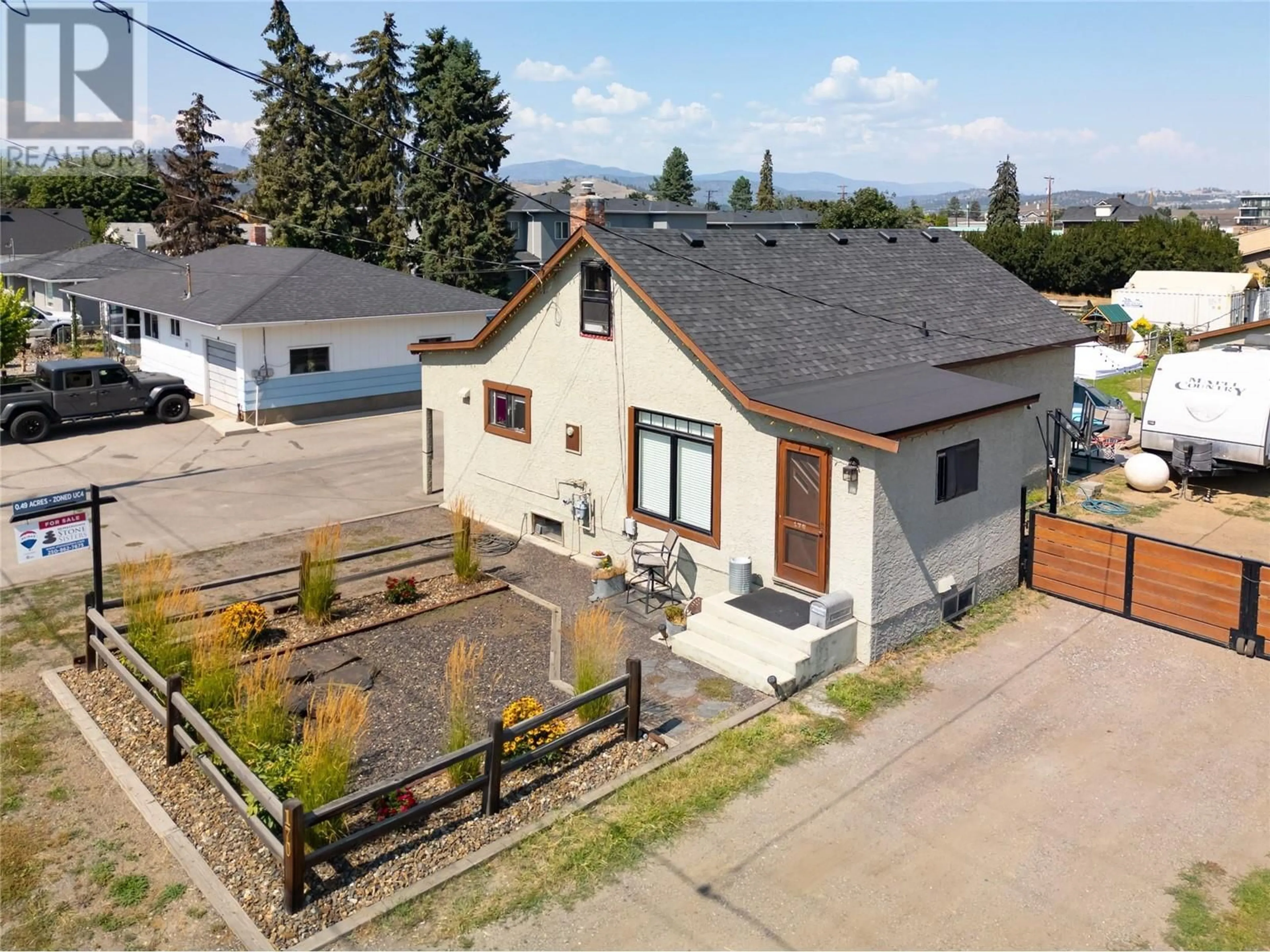 A pic from outside/outdoor area/front of a property/back of a property/a pic from drone, street for 170 Mugford Road, Kelowna British Columbia V1X2E2