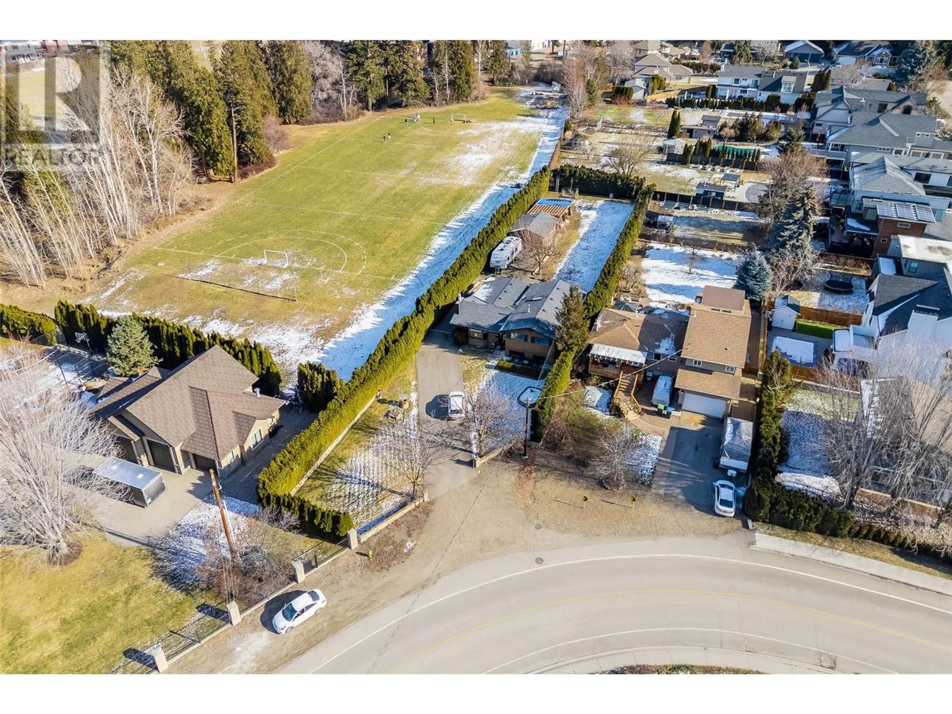 A pic from outside/outdoor area/front of a property/back of a property/a pic from drone, street for 4553 McClure Road, Kelowna British Columbia V1W1L4