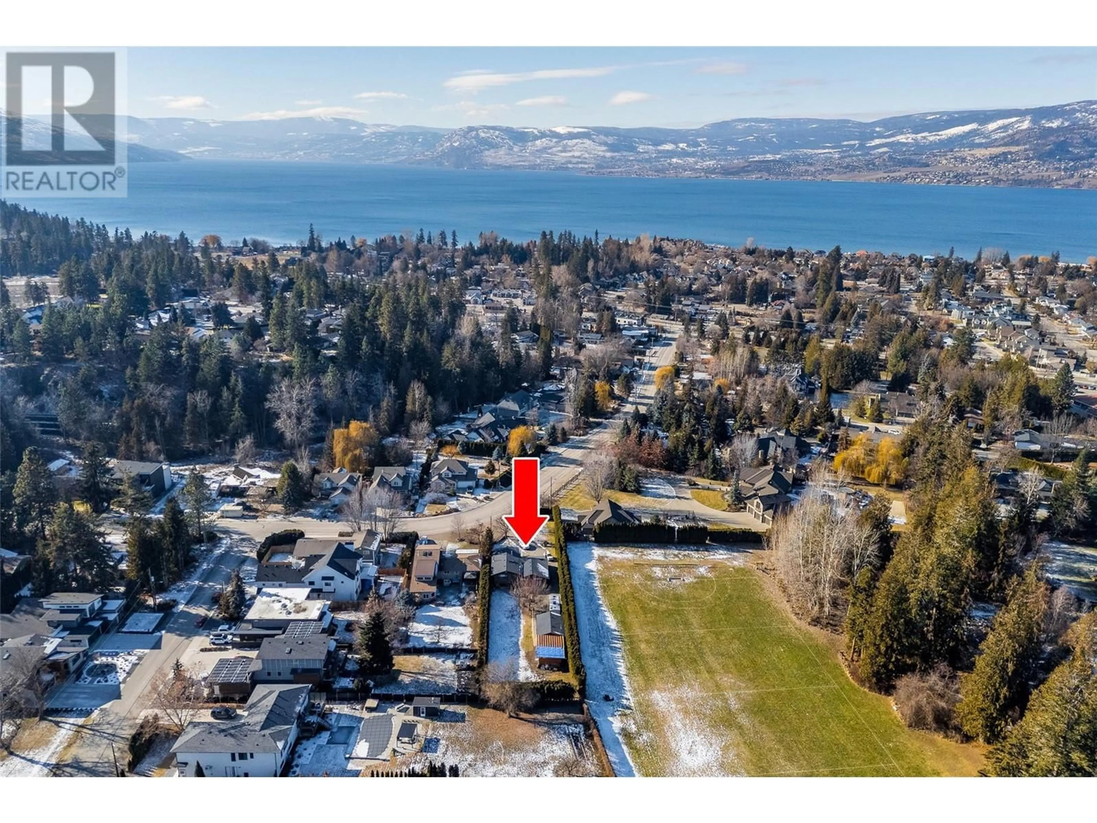 A pic from outside/outdoor area/front of a property/back of a property/a pic from drone, water/lake/river/ocean view for 4553 McClure Road, Kelowna British Columbia V1W1L4