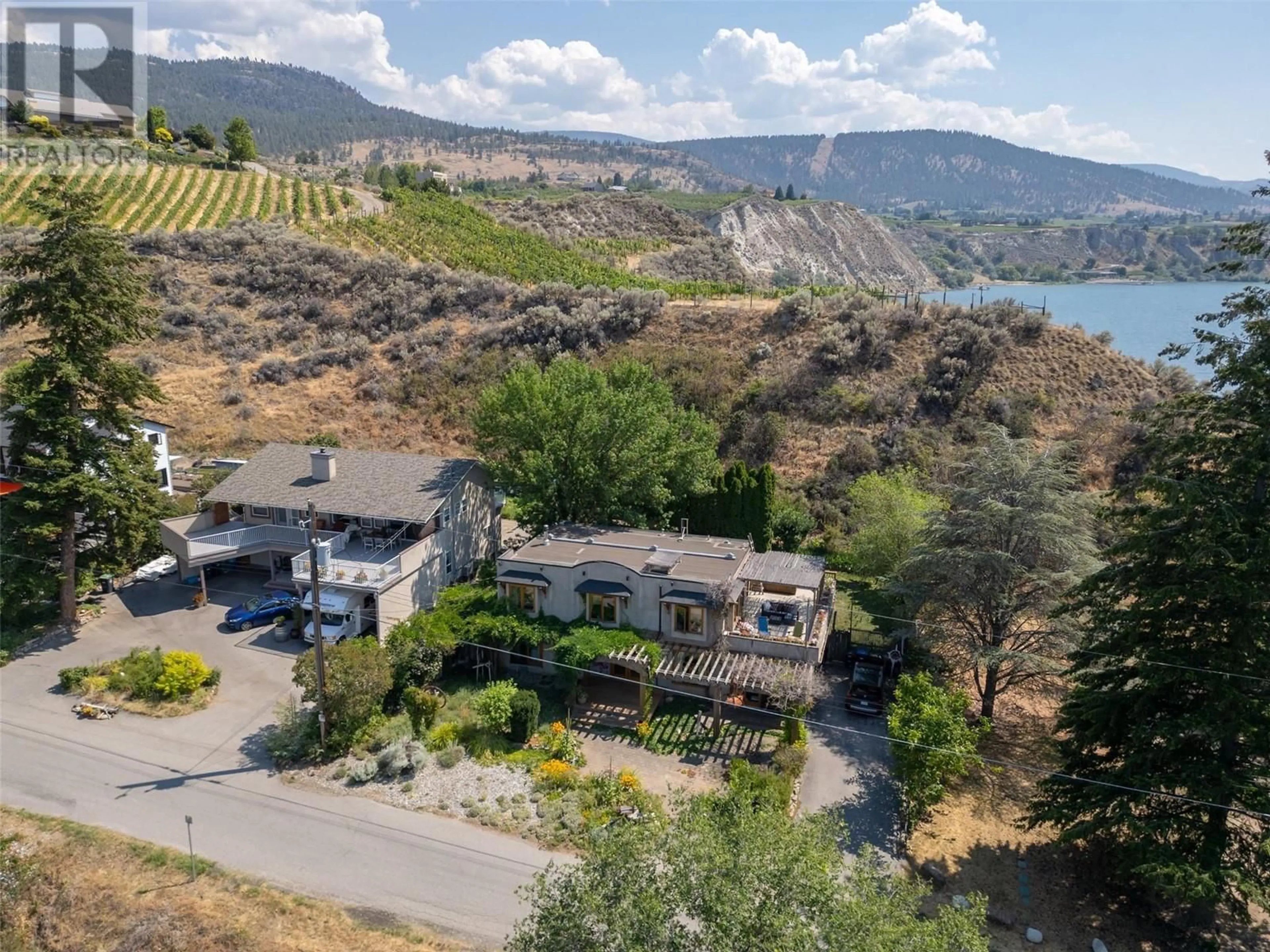 A pic from outside/outdoor area/front of a property/back of a property/a pic from drone, water/lake/river/ocean view for 830 Three Mile Road, Penticton British Columbia V2A8T7