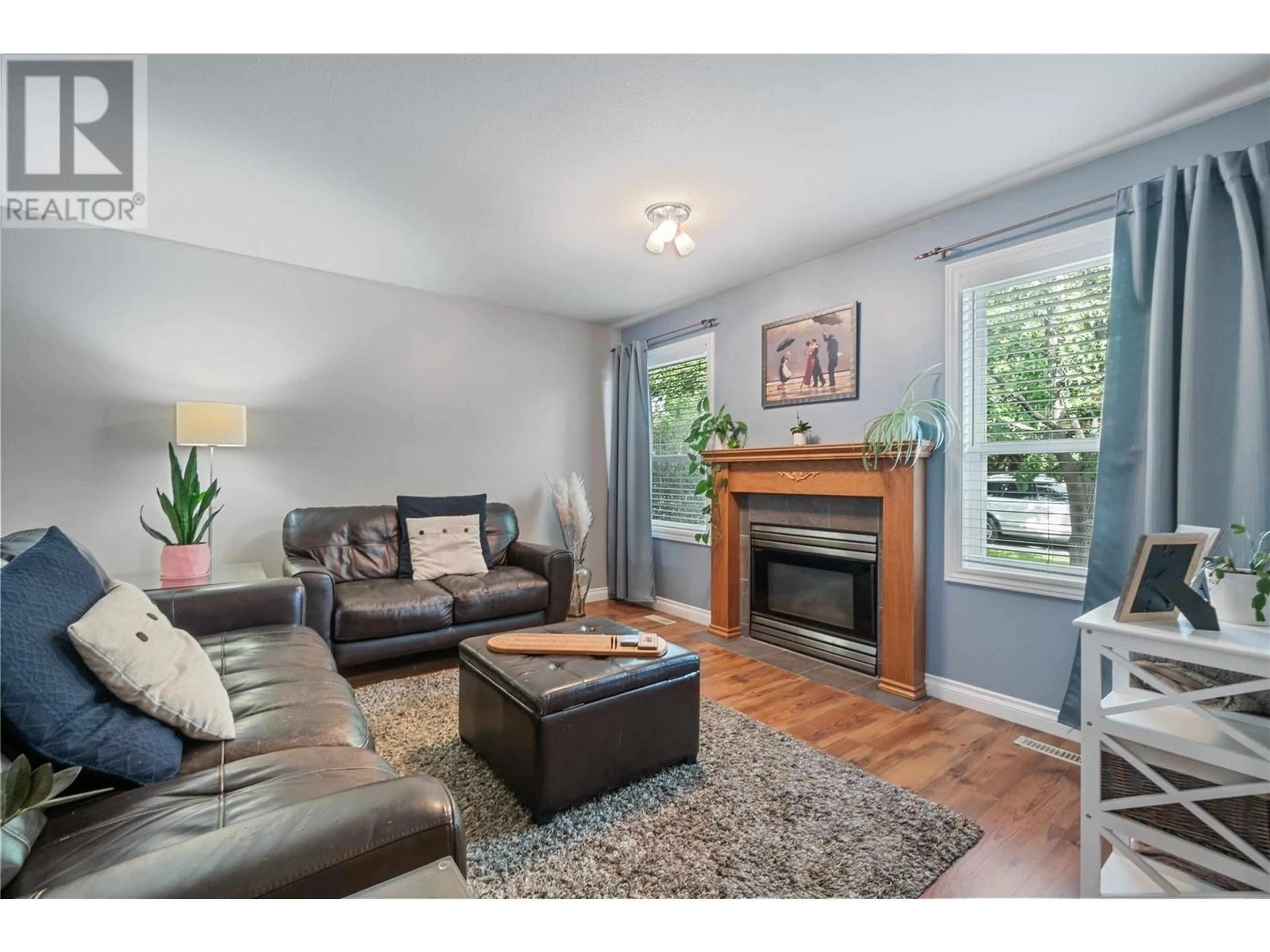 Living room with furniture, wood/laminate floor for 284 Drysdale Boulevard, Kelowna British Columbia V1V1P5