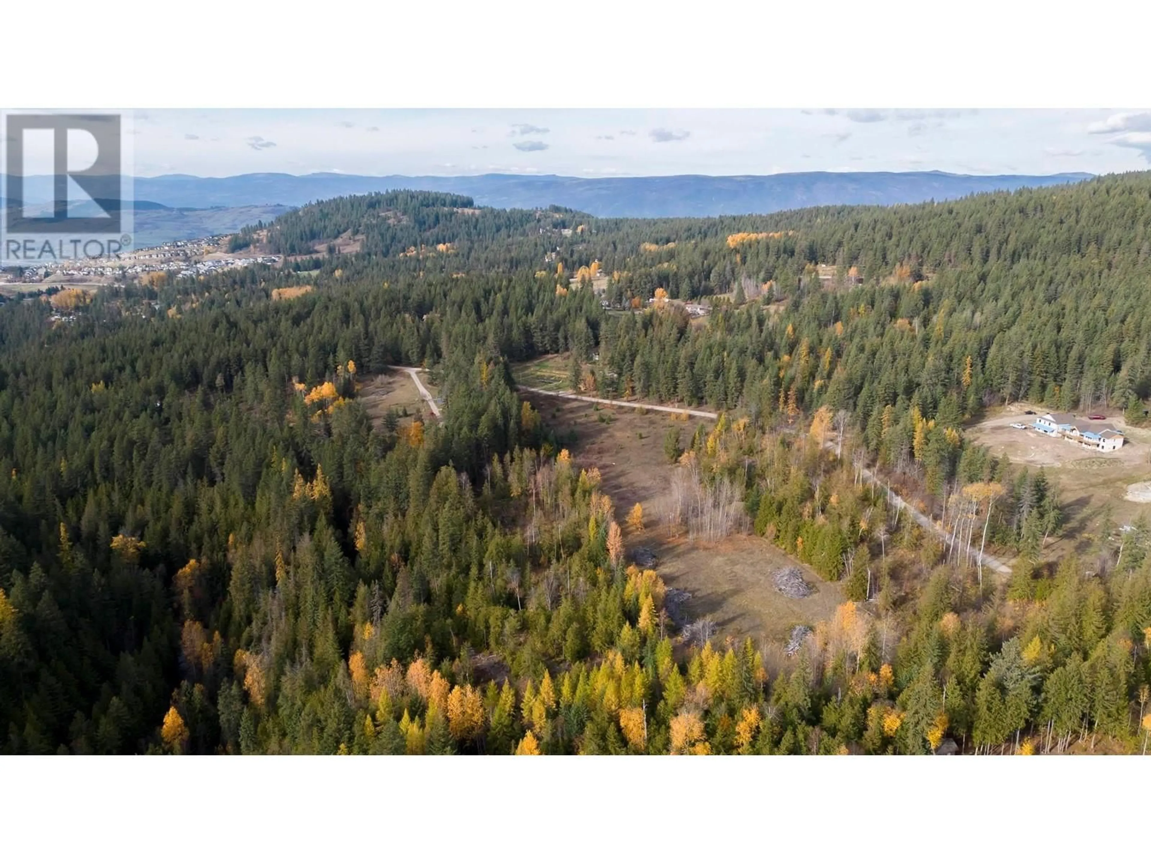 A pic from outside/outdoor area/front of a property/back of a property/a pic from drone, forest/trees view for WALLACE ROAD, Vernon British Columbia V1B3N2
