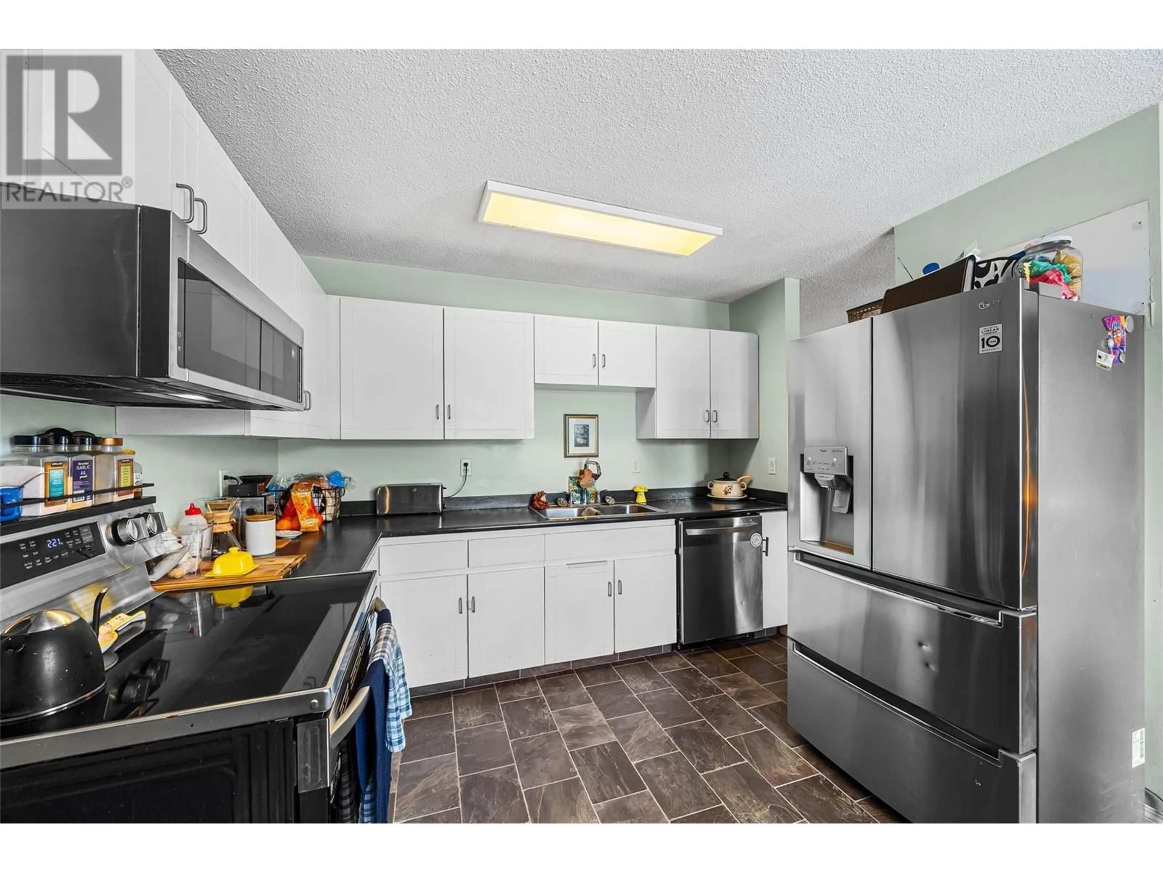 Standard kitchen, ceramic/tile floor for 311 HOLLYBURN Drive, Kamloops British Columbia V2E1Y9