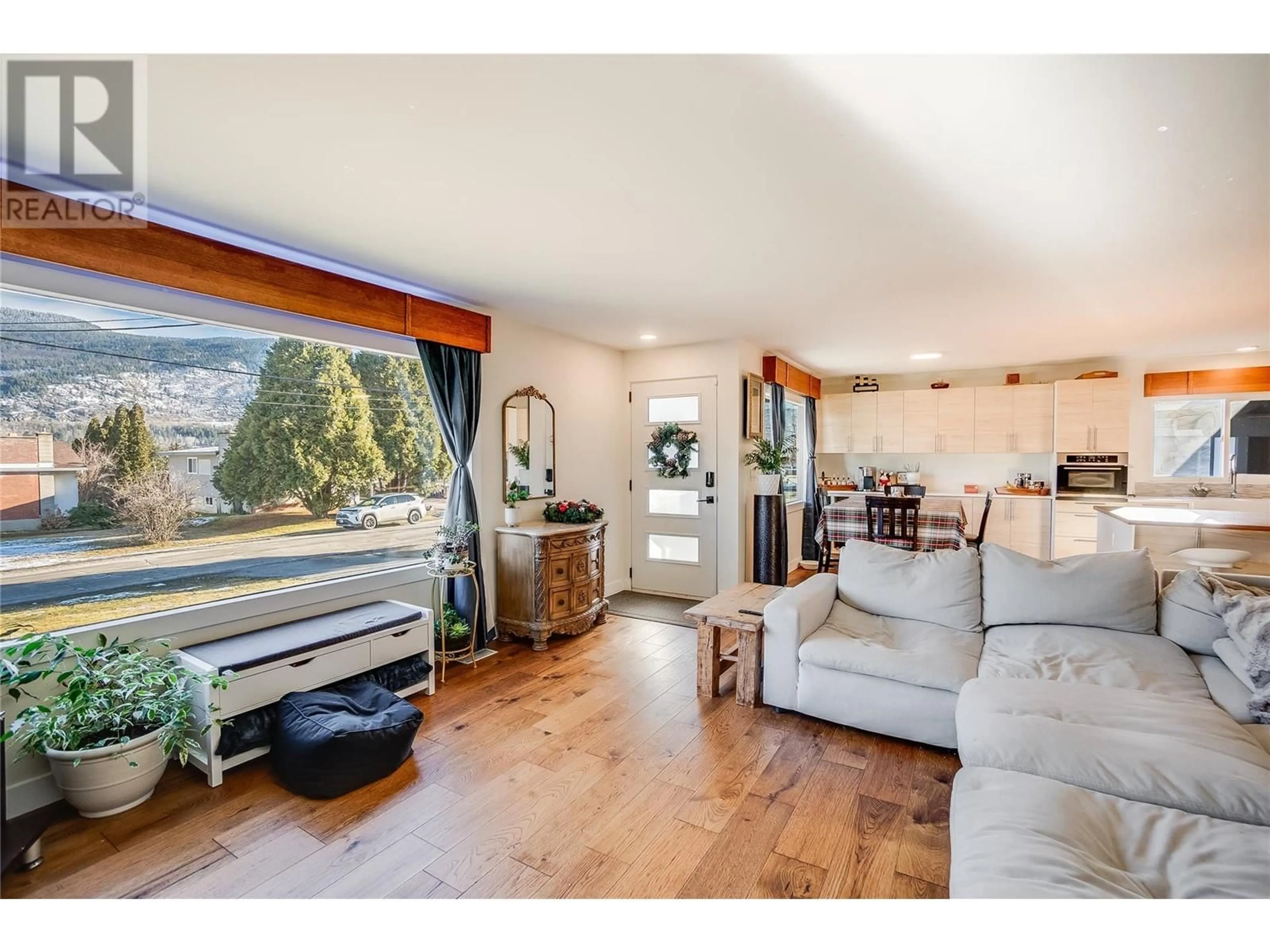 Living room with furniture, wood/laminate floor for 3408 8th Avenue, Castlegar British Columbia V1N2Y4