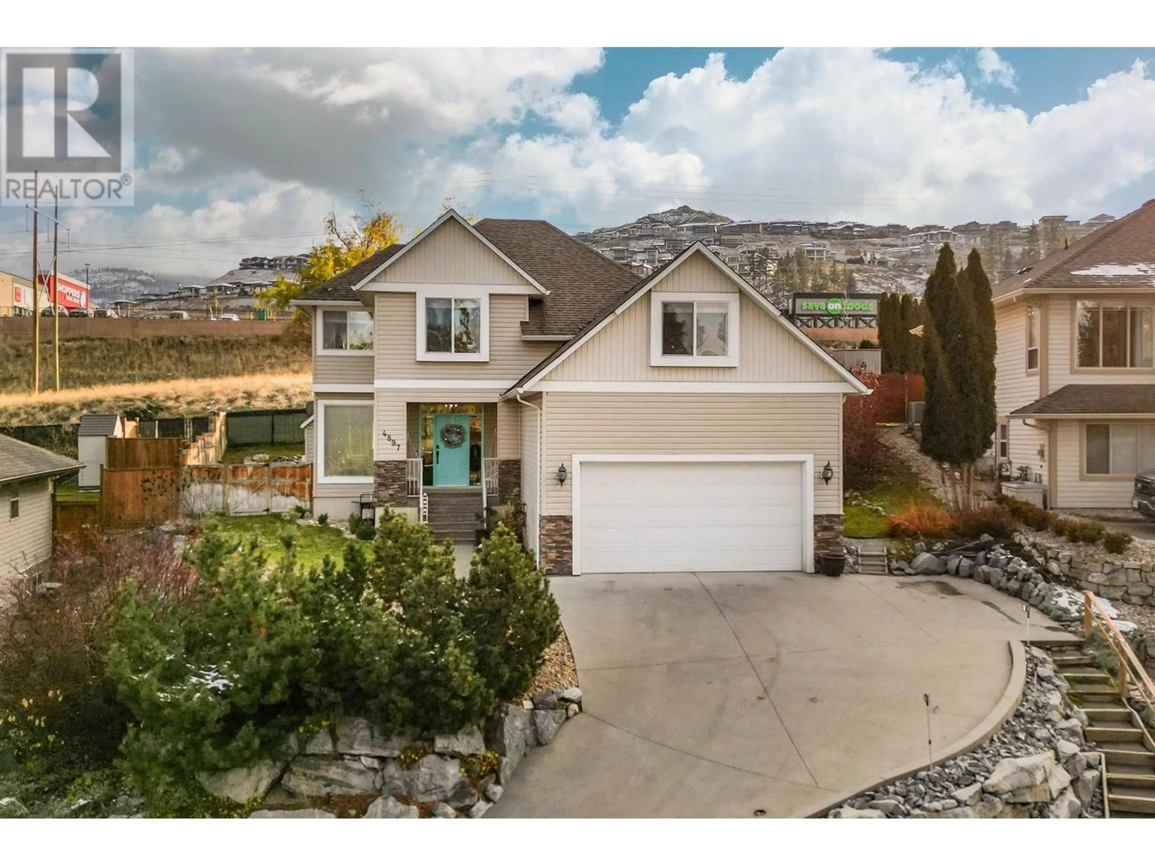 A pic from outside/outdoor area/front of a property/back of a property/a pic from drone, mountain view for 4897 Warbler Court, Kelowna British Columbia V1W5A1