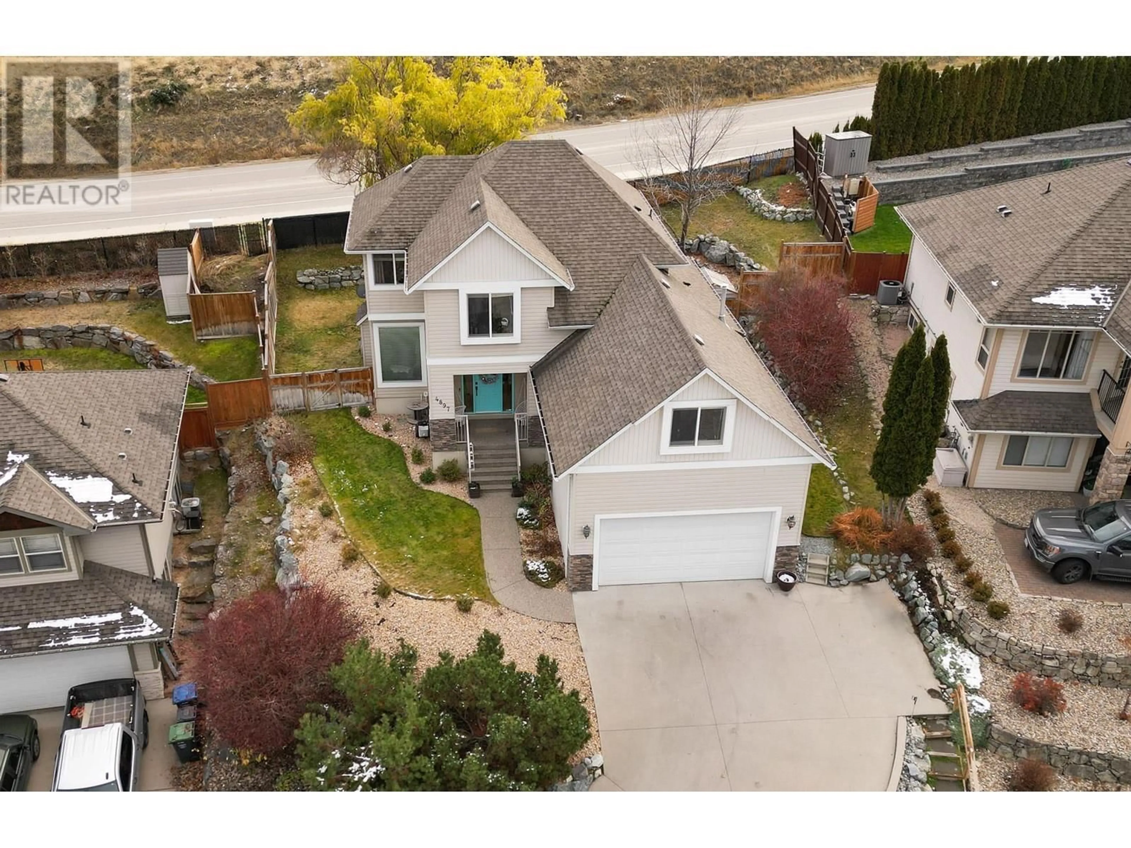 A pic from outside/outdoor area/front of a property/back of a property/a pic from drone, street for 4897 Warbler Court, Kelowna British Columbia V1W5A1