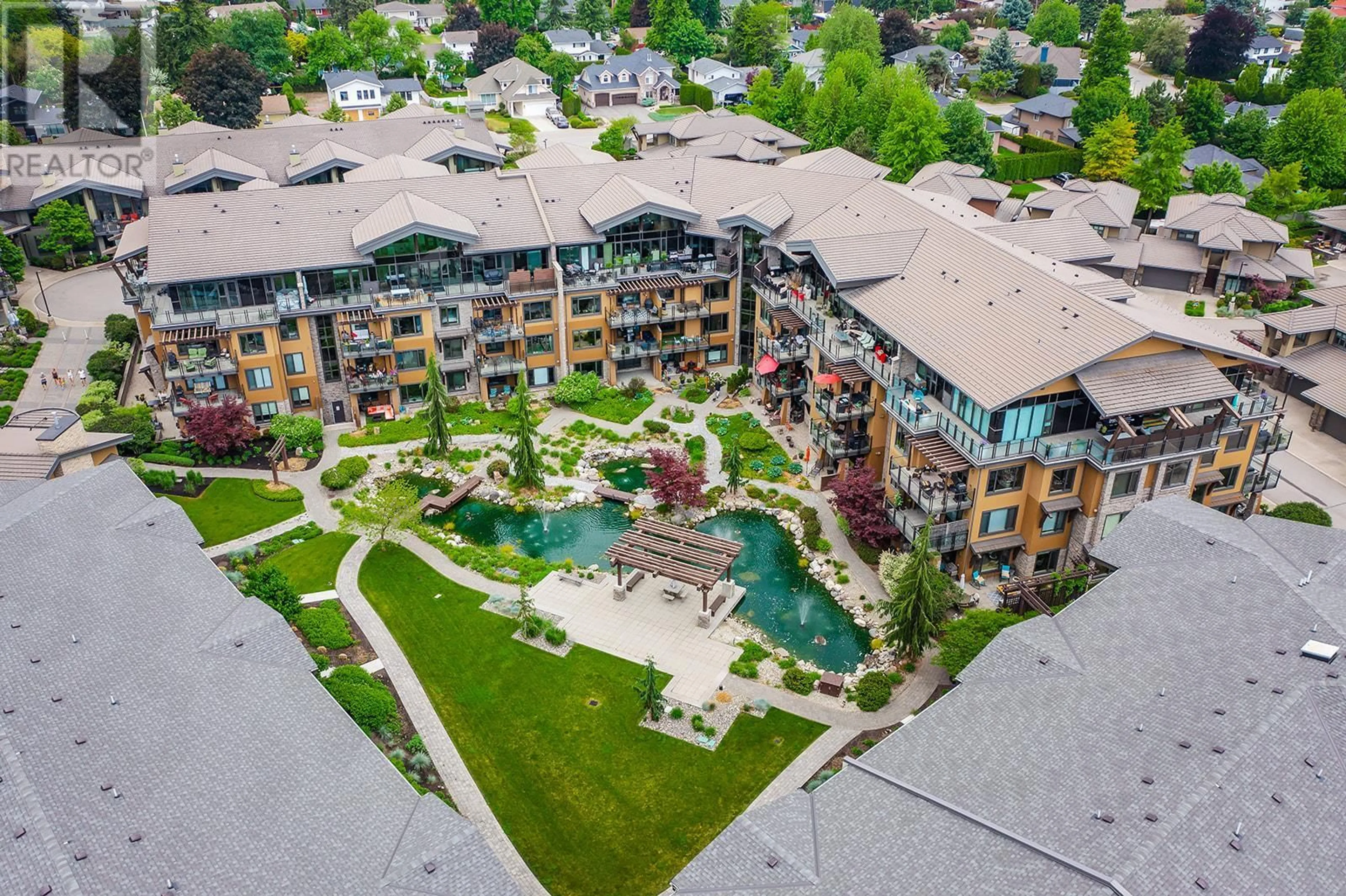 A pic from outside/outdoor area/front of a property/back of a property/a pic from drone, unknown for 580 Sarsons Road Unit# 309, Kelowna British Columbia V1W5H5