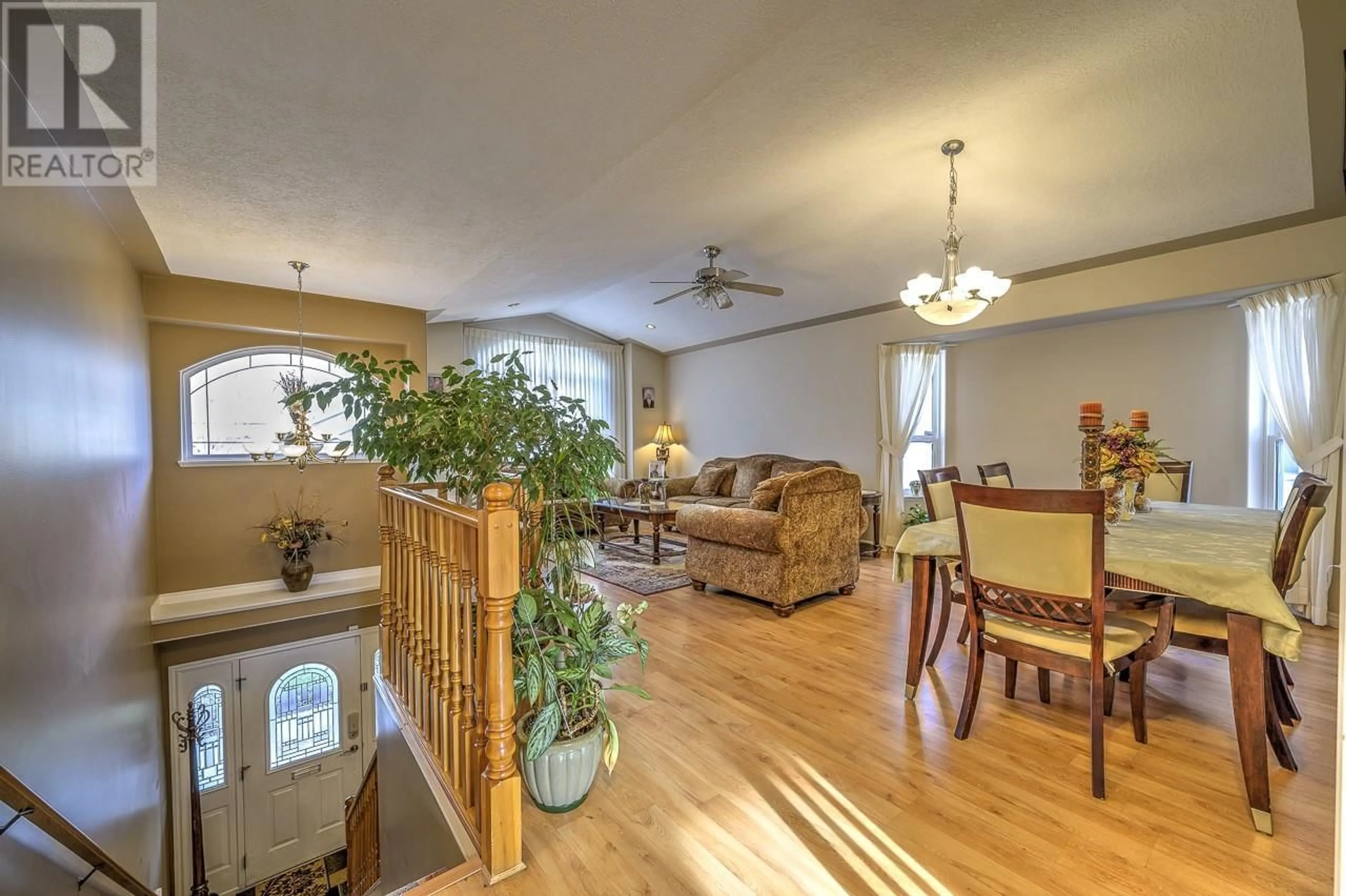 Living room with furniture, wood/laminate floor for 2617 Briarwood Avenue, Kamloops British Columbia V2B8P7