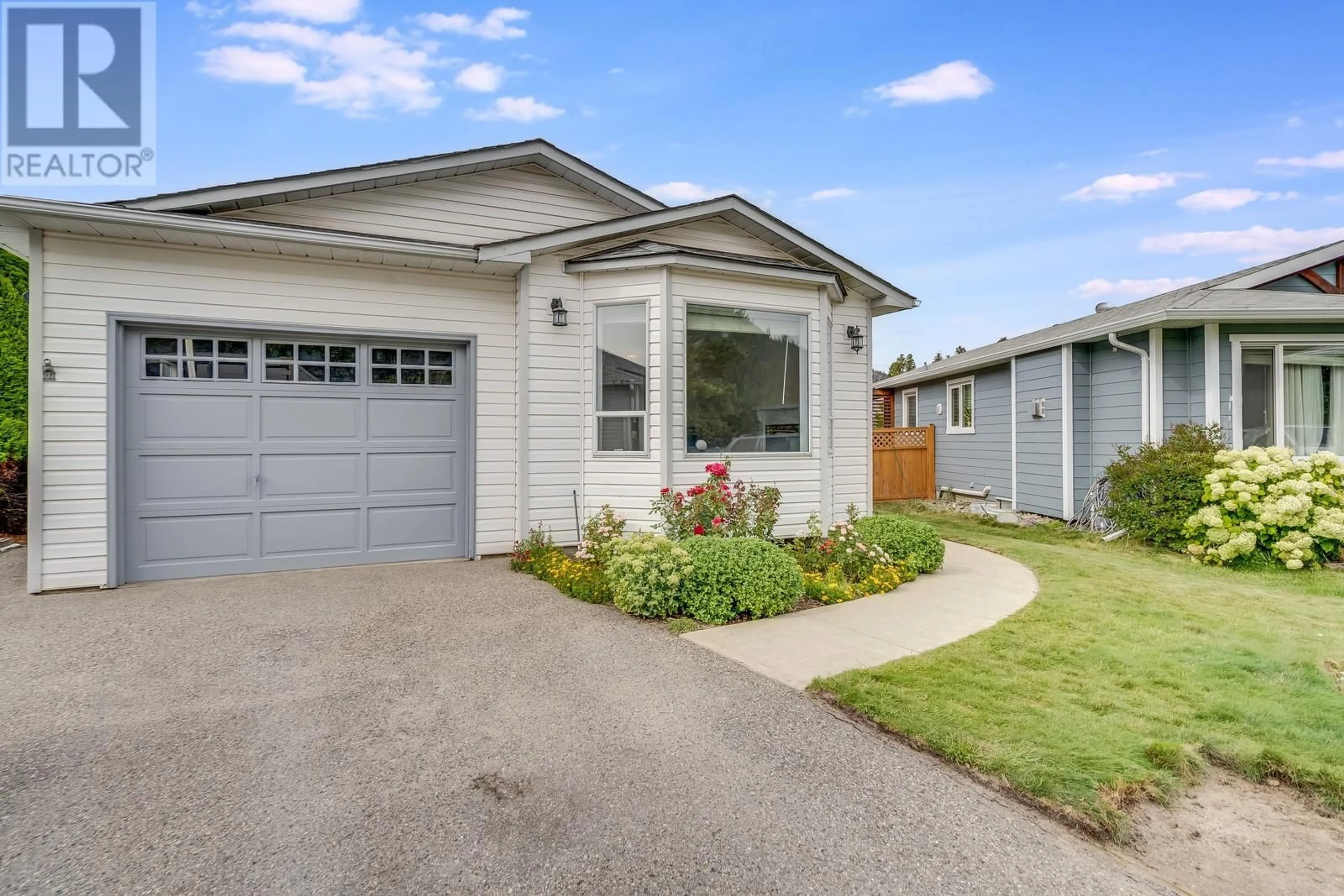 Home with vinyl exterior material, street for 2629 Applegreen Court, West Kelowna British Columbia V1Z3K8