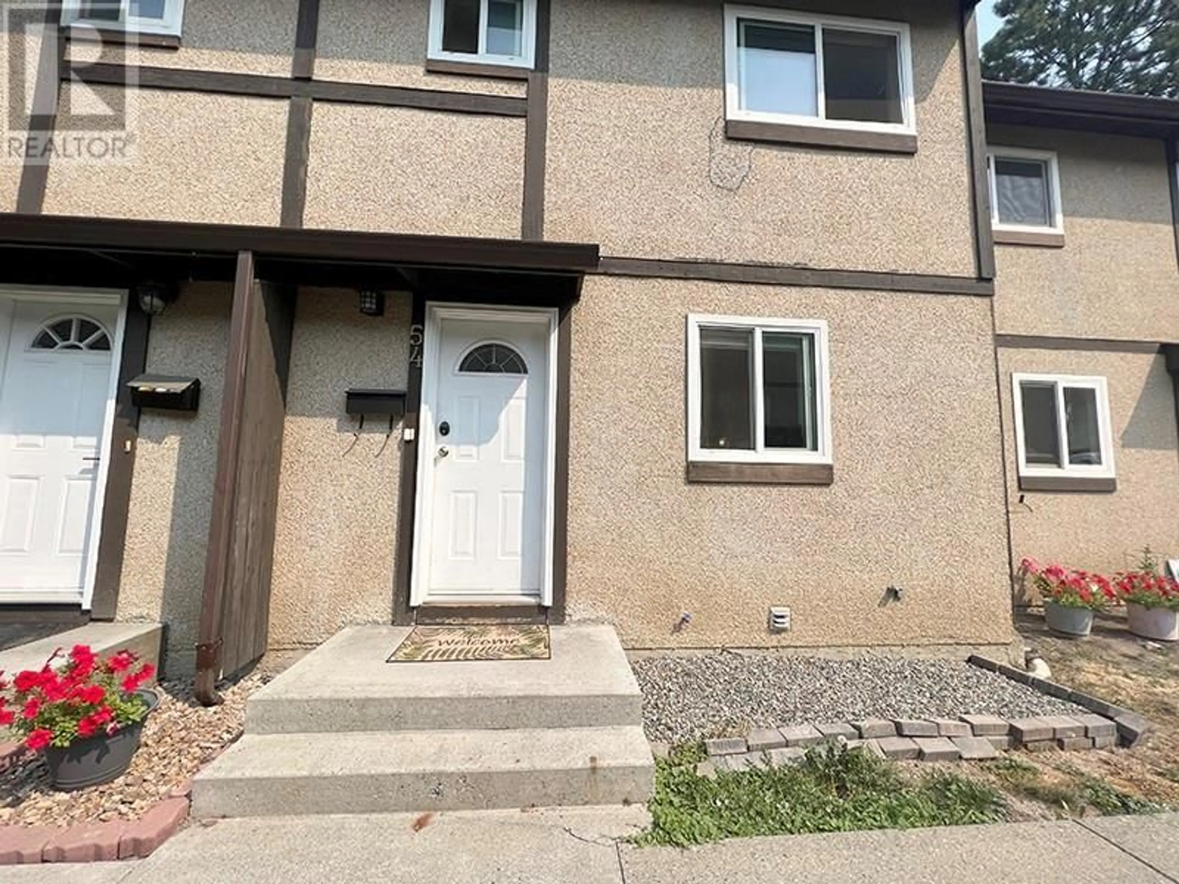 Home with vinyl exterior material, street for 1605 SUMMIT Drive Unit# 54, Kamloops British Columbia V2H1T7