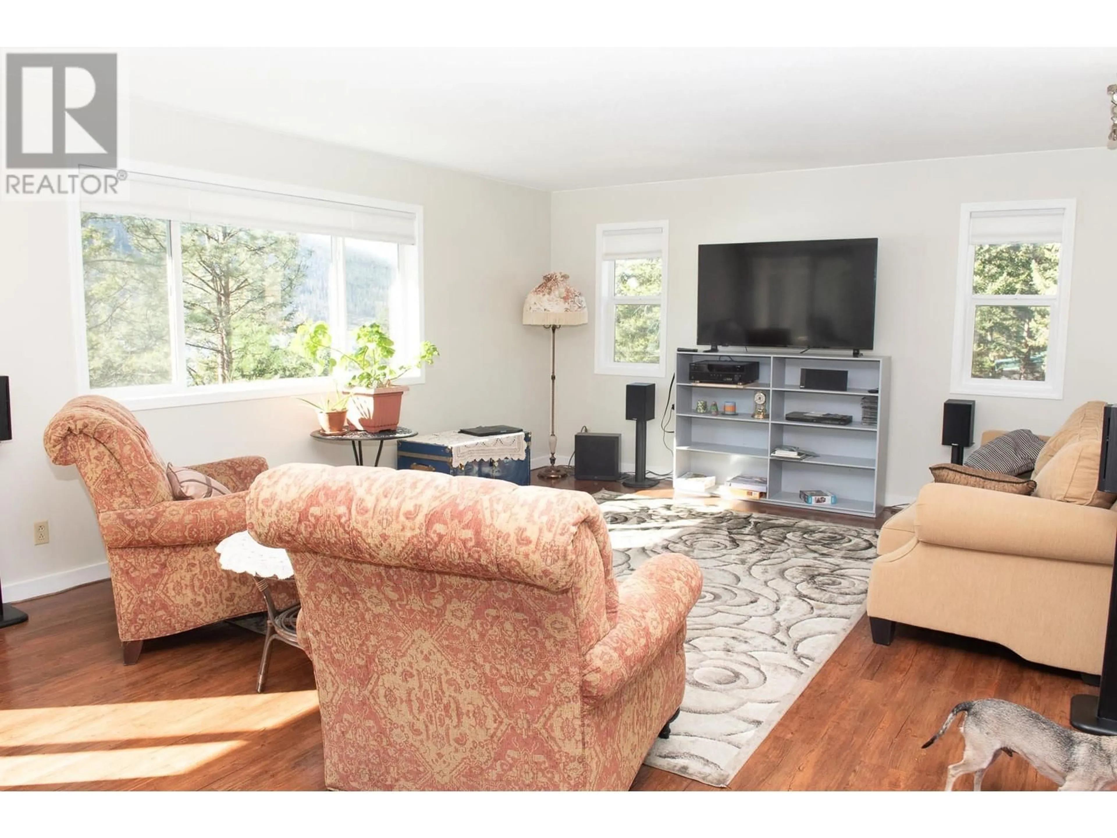 Living room with furniture, wood/laminate floor for 3022 LOON LAKE ROAD, 70 Mile House British Columbia V0K2K1