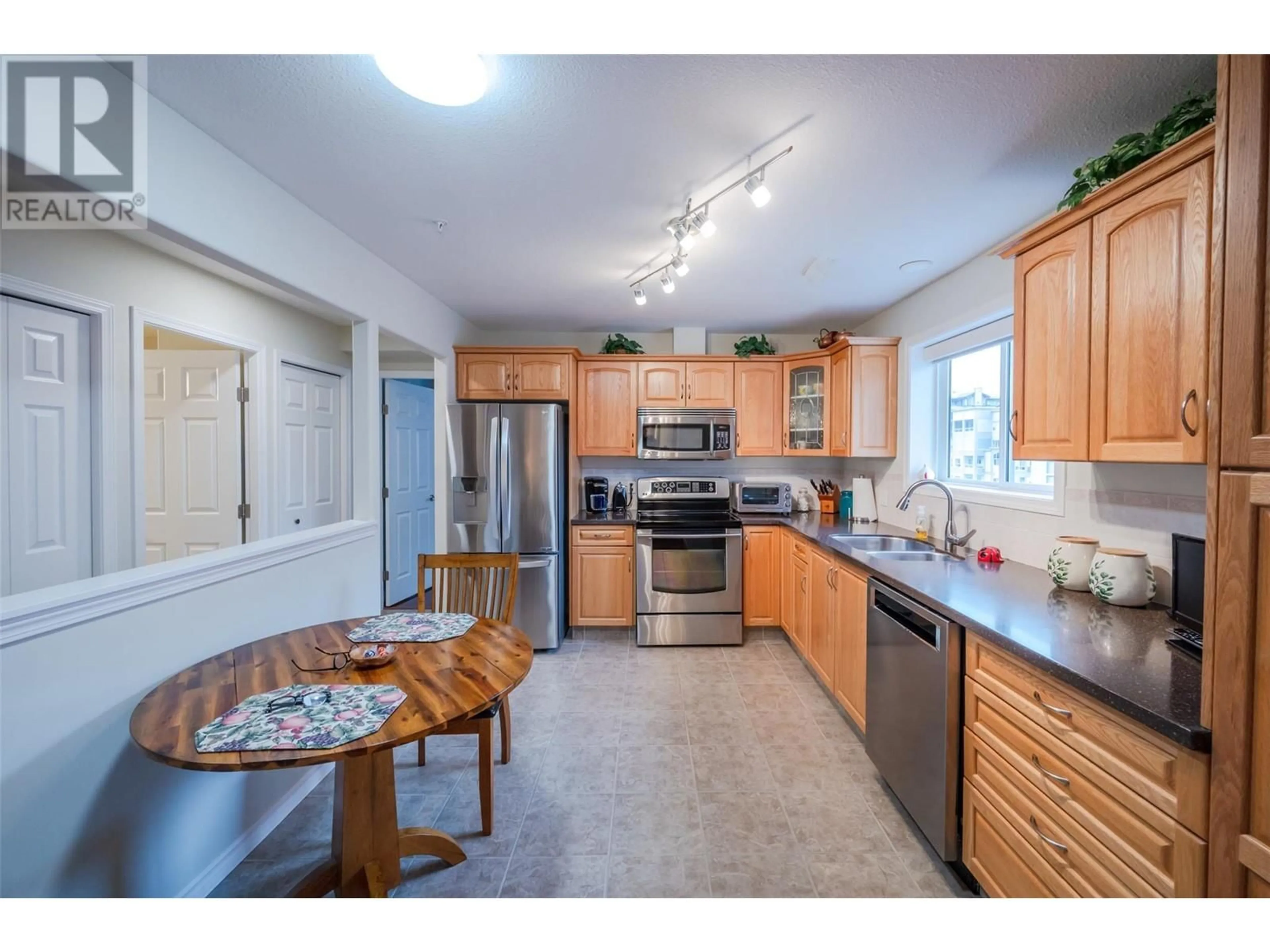 Open concept kitchen, unknown for 2285 Atkinson Street Unit# 702, Penticton British Columbia V2A8R7