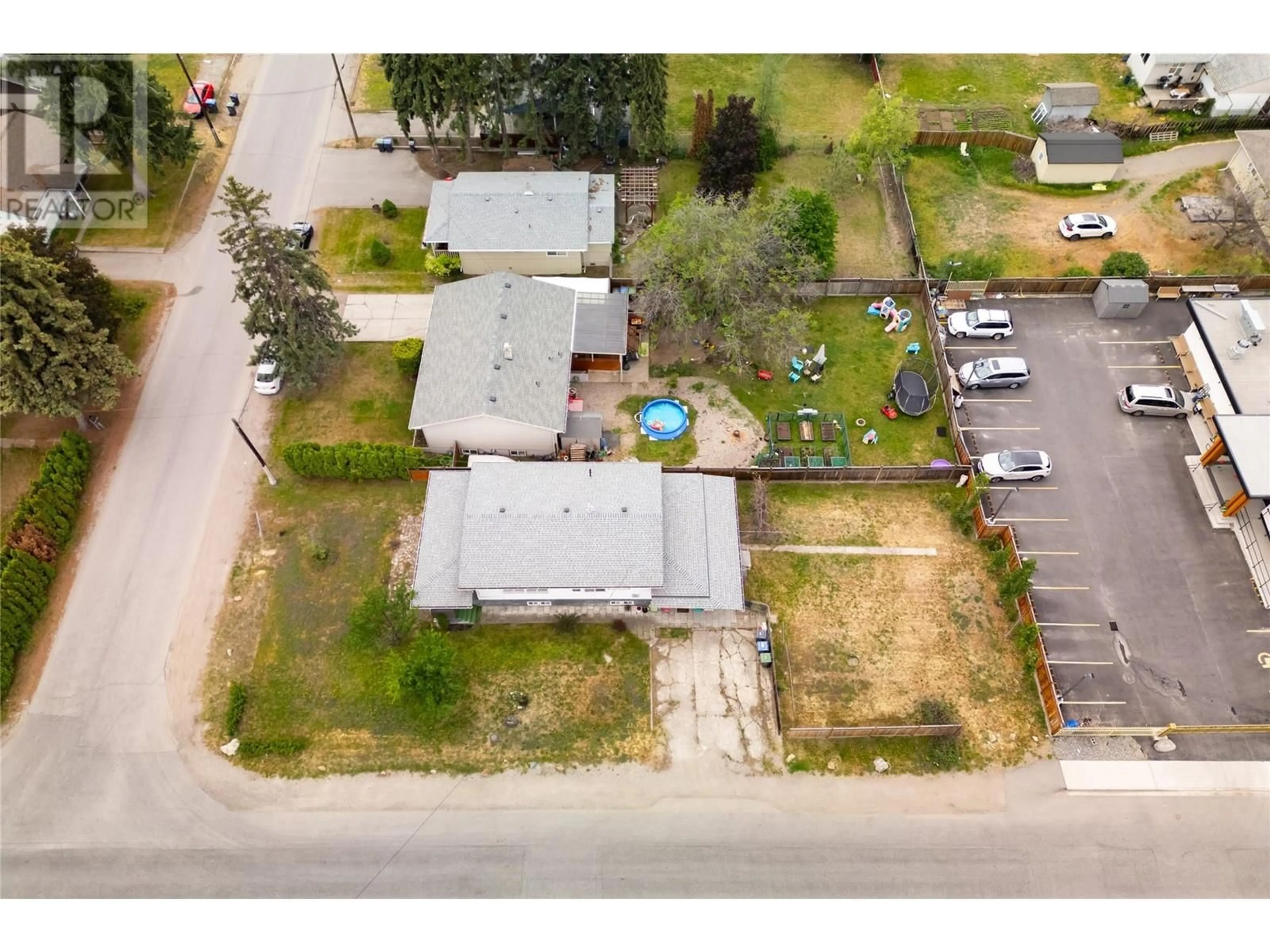 A pic from outside/outdoor area/front of a property/back of a property/a pic from drone, street for 155 Mugford Road, Kelowna British Columbia V1X2E3