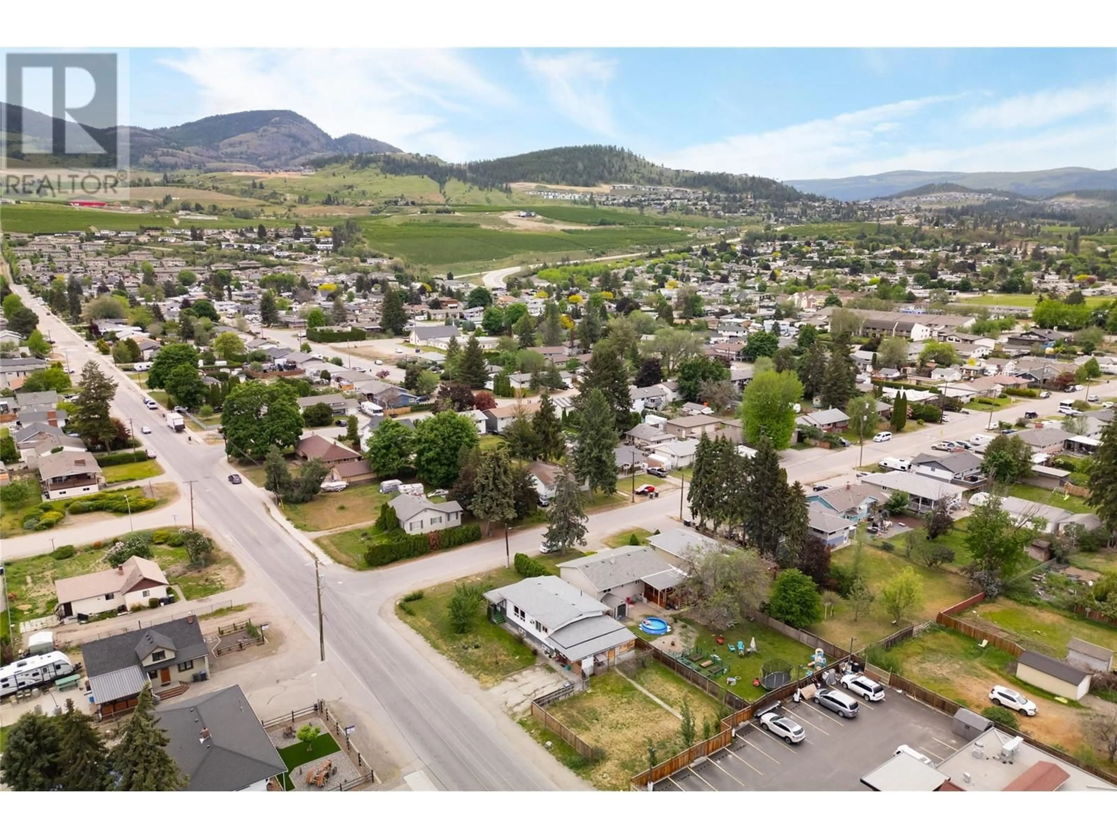 A pic from outside/outdoor area/front of a property/back of a property/a pic from drone, mountain view for 155 Mugford Road, Kelowna British Columbia V1X2E3