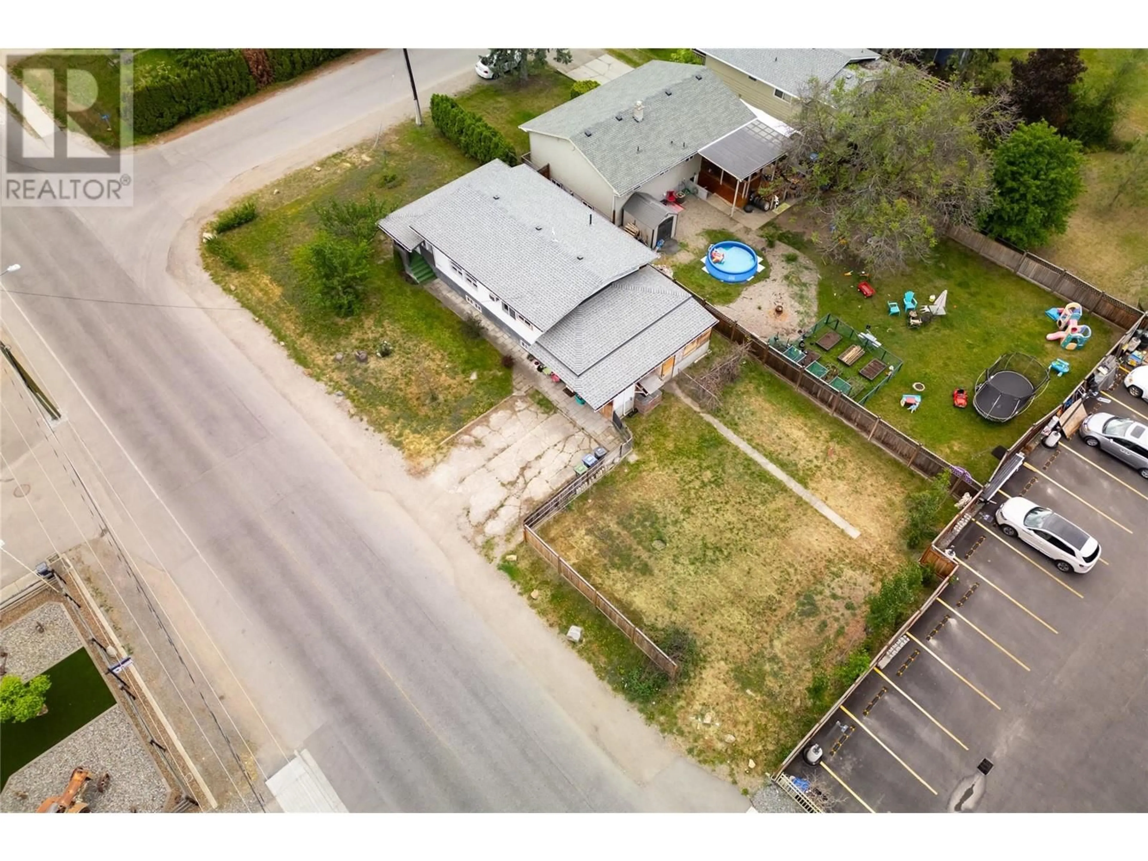 A pic from outside/outdoor area/front of a property/back of a property/a pic from drone, street for 155 Mugford Road, Kelowna British Columbia V1X2E3