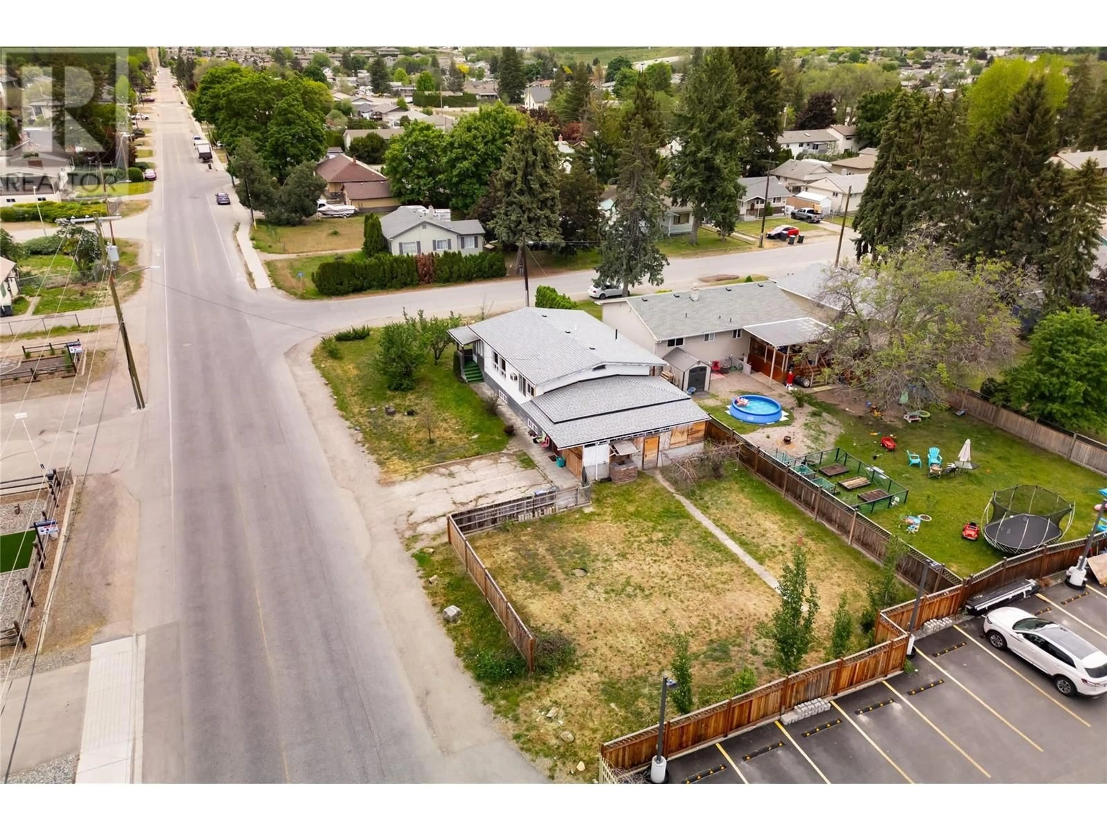 A pic from outside/outdoor area/front of a property/back of a property/a pic from drone, street for 155 Mugford Road, Kelowna British Columbia V1X2E3