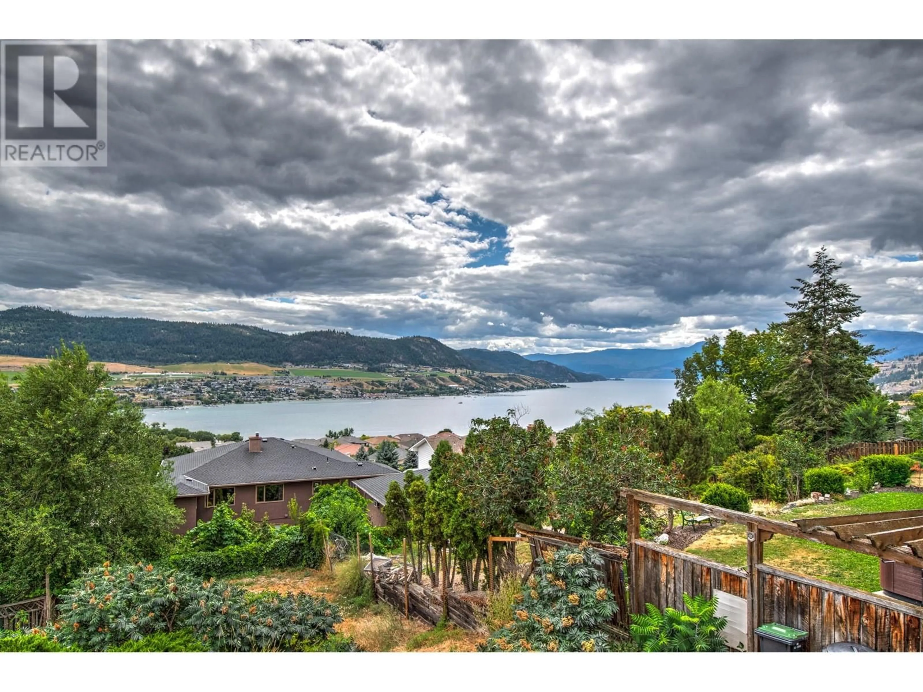 A pic from outside/outdoor area/front of a property/back of a property/a pic from drone, water/lake/river/ocean view for 7048 Appaloosa Way, Vernon British Columbia V1H1B9