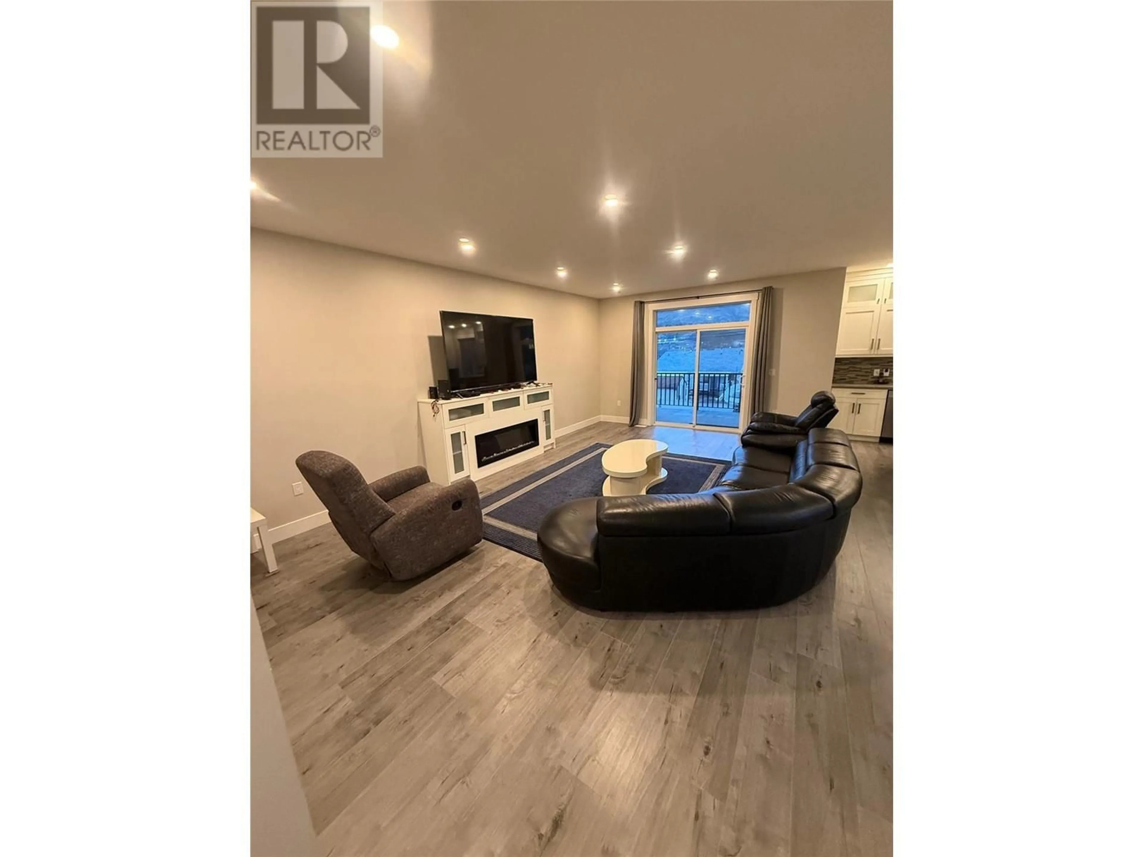 Living room with furniture, wood/laminate floor for 1128 LETHBRIDGE Avenue, Kamloops British Columbia V2B1Y3