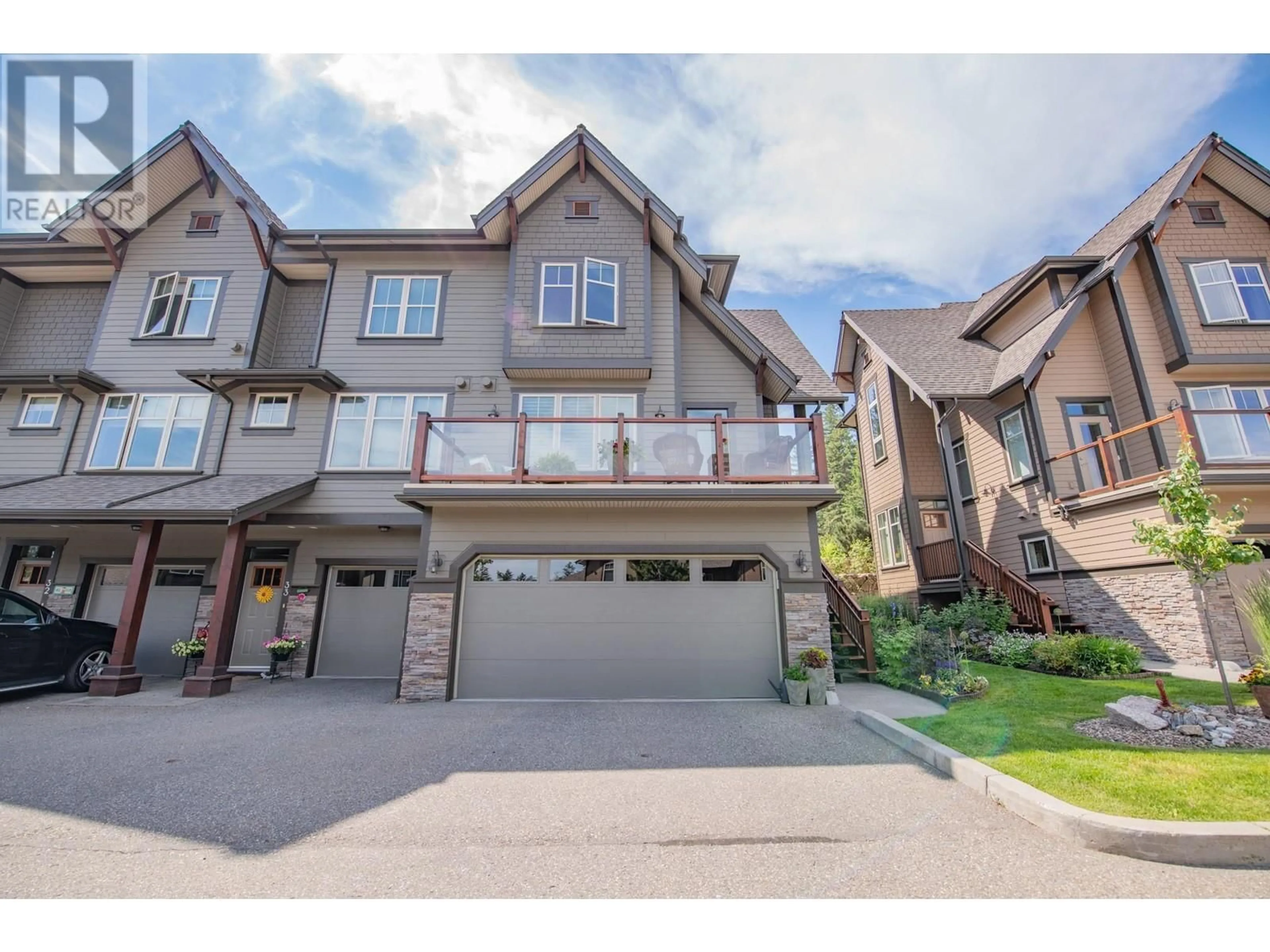 A pic from outside/outdoor area/front of a property/back of a property/a pic from drone, street for 333 Longspoon Drive Unit# 34, Vernon British Columbia V1H2L1