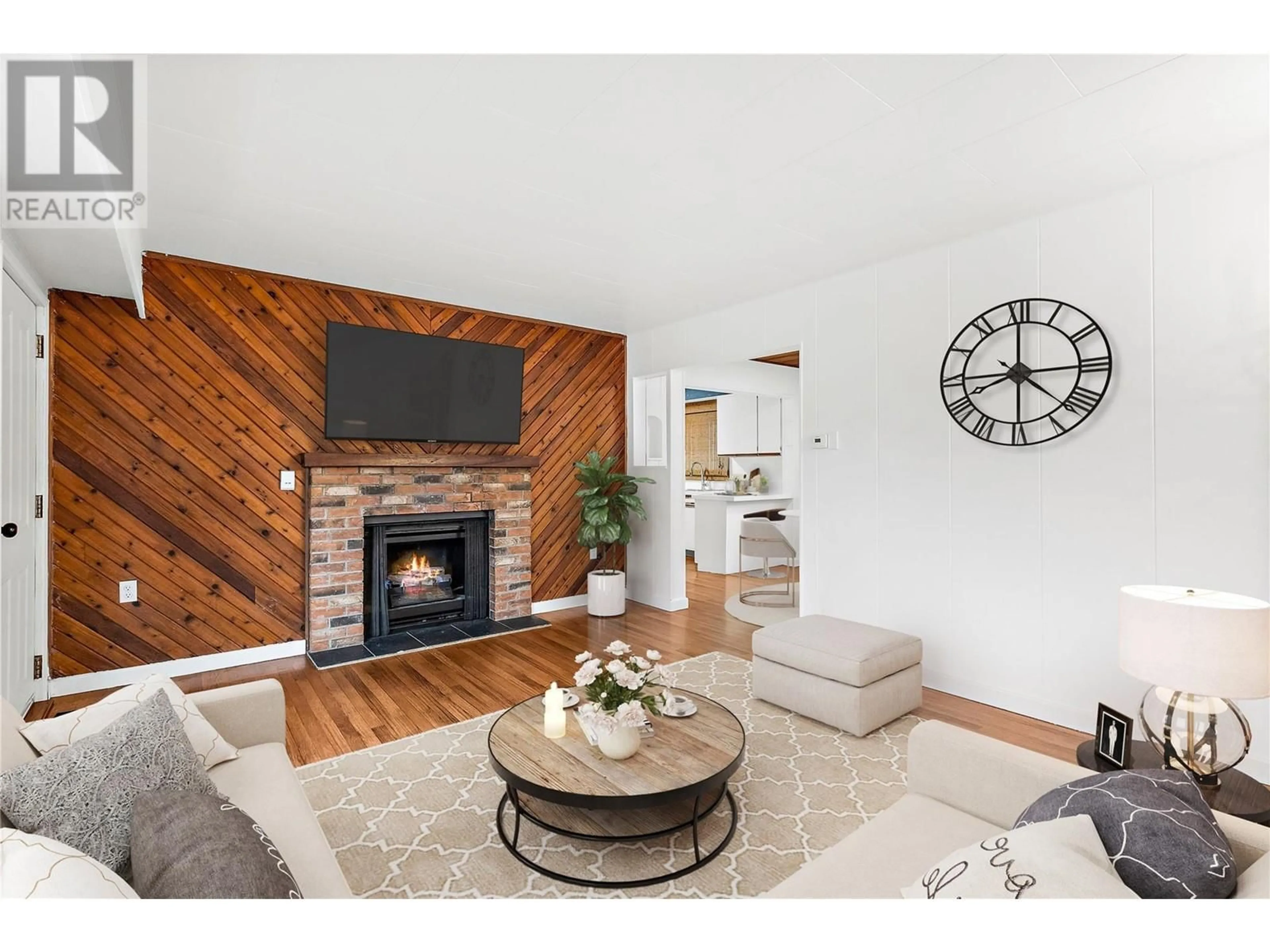 Living room with furniture, wood/laminate floor for 570 1 Avenue SE, Salmon Arm British Columbia V1E1G7