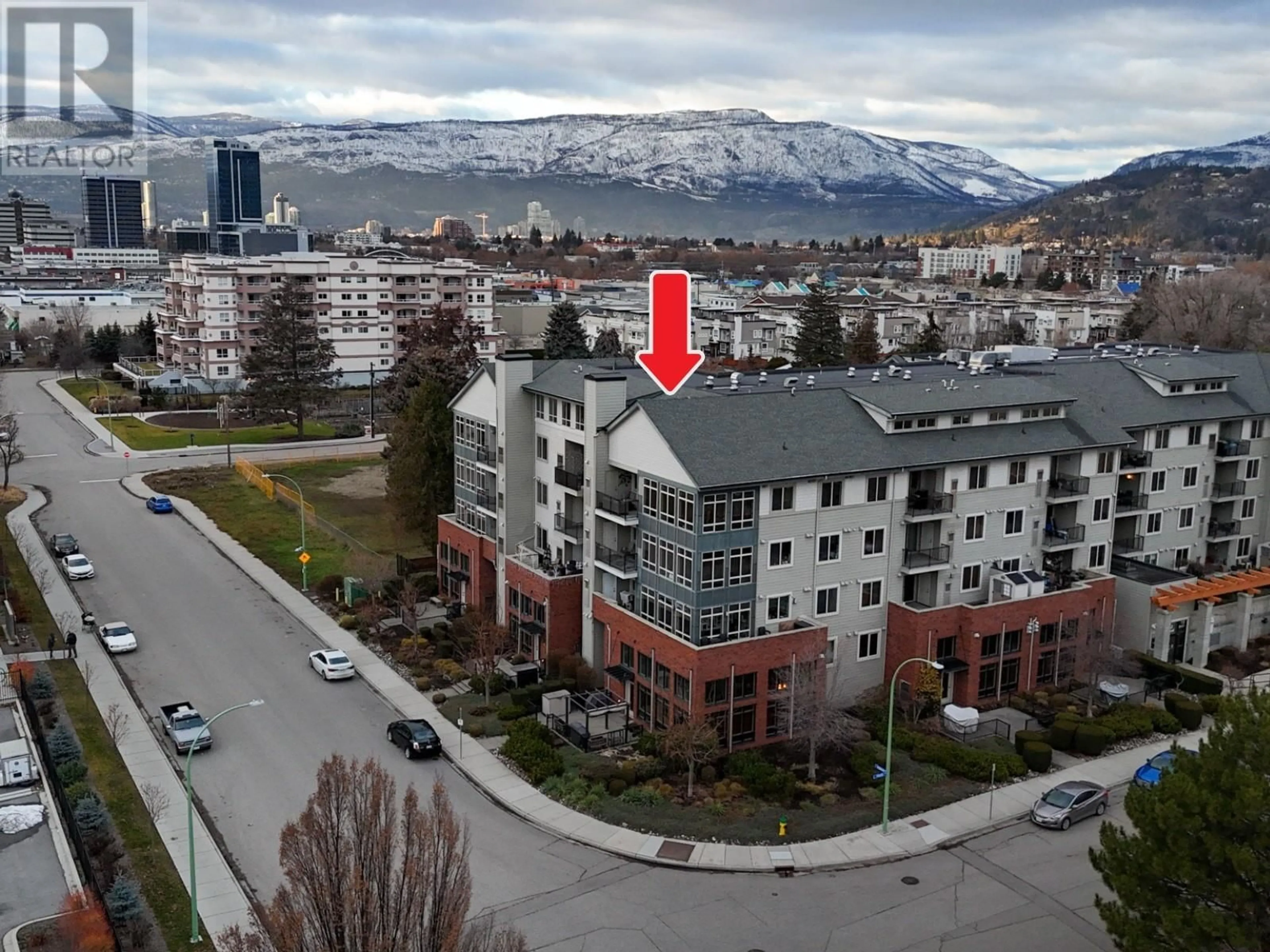 A pic from outside/outdoor area/front of a property/back of a property/a pic from drone, mountain view for 2142 Vasile Road Unit# 403, Kelowna British Columbia V1Y6H5