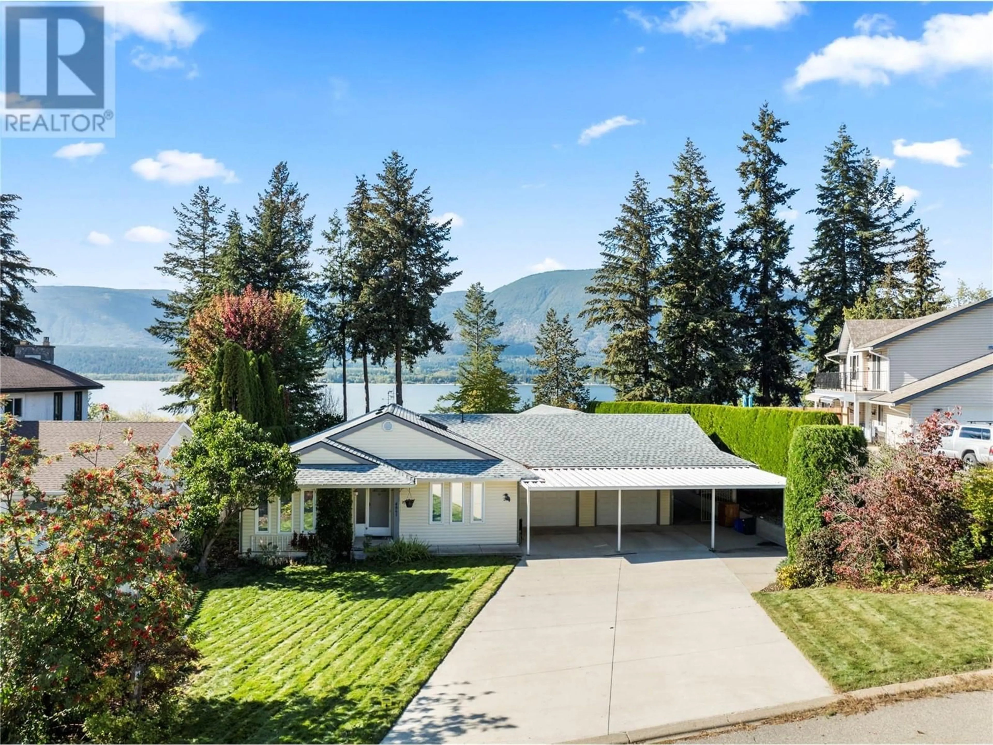 A pic from outside/outdoor area/front of a property/back of a property/a pic from drone, water/lake/river/ocean view for 4861 11 Street NE, Salmon Arm British Columbia V1E3N9