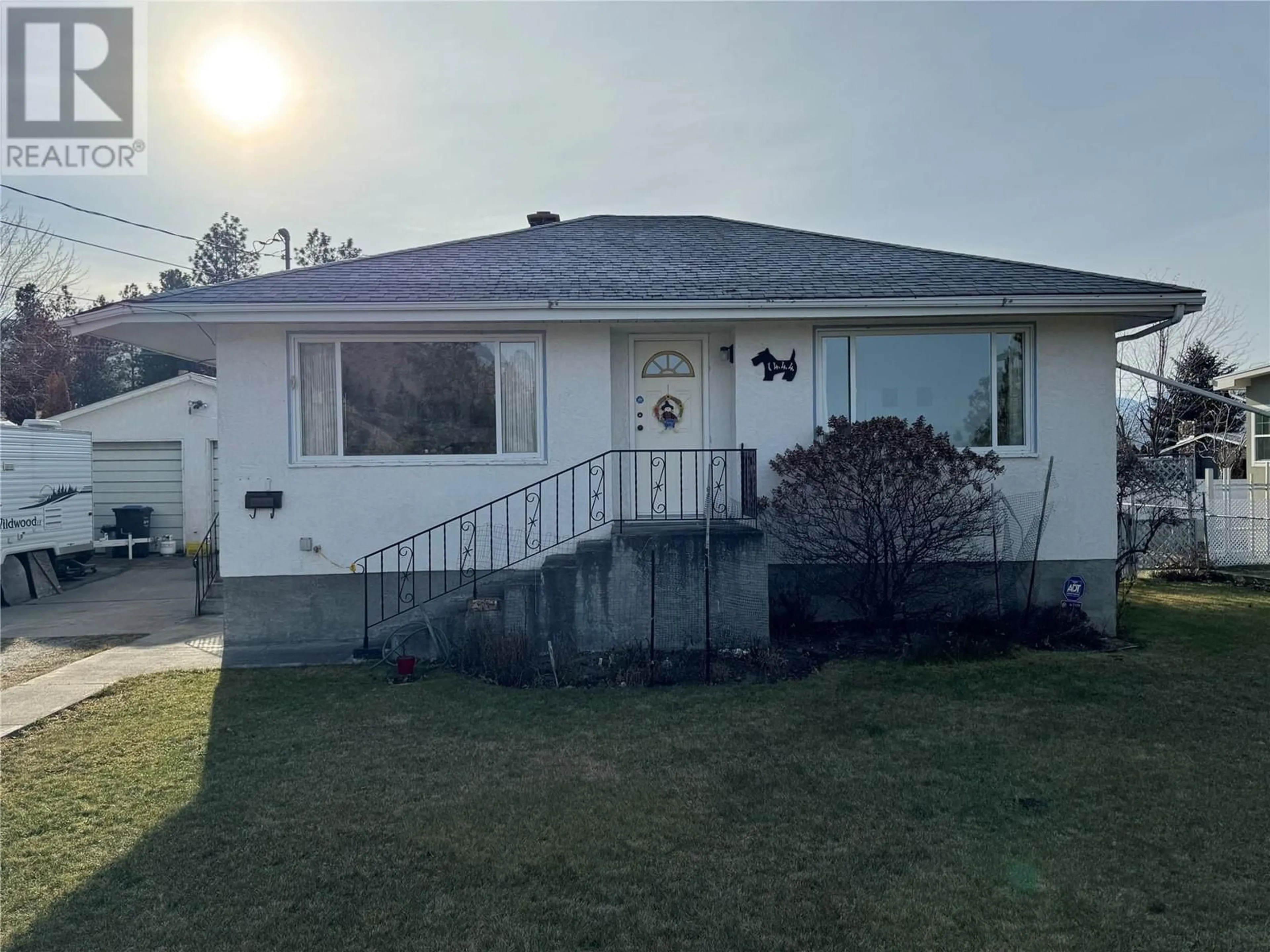 Home with vinyl exterior material, street for 1444 RIDGEDALE AVENUE, Penticton British Columbia V2A2S2