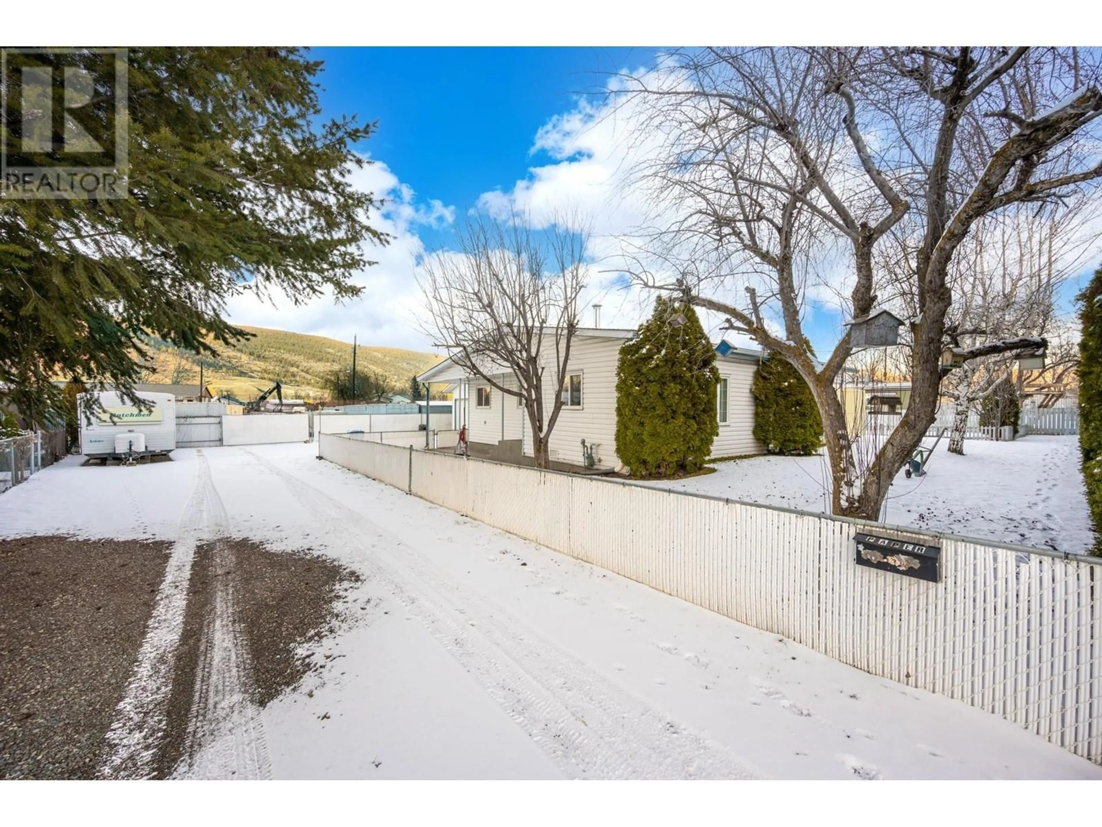 A pic from outside/outdoor area/front of a property/back of a property/a pic from drone, mountain view for 1590 FIR AVENUE, Merritt British Columbia V1K0C3