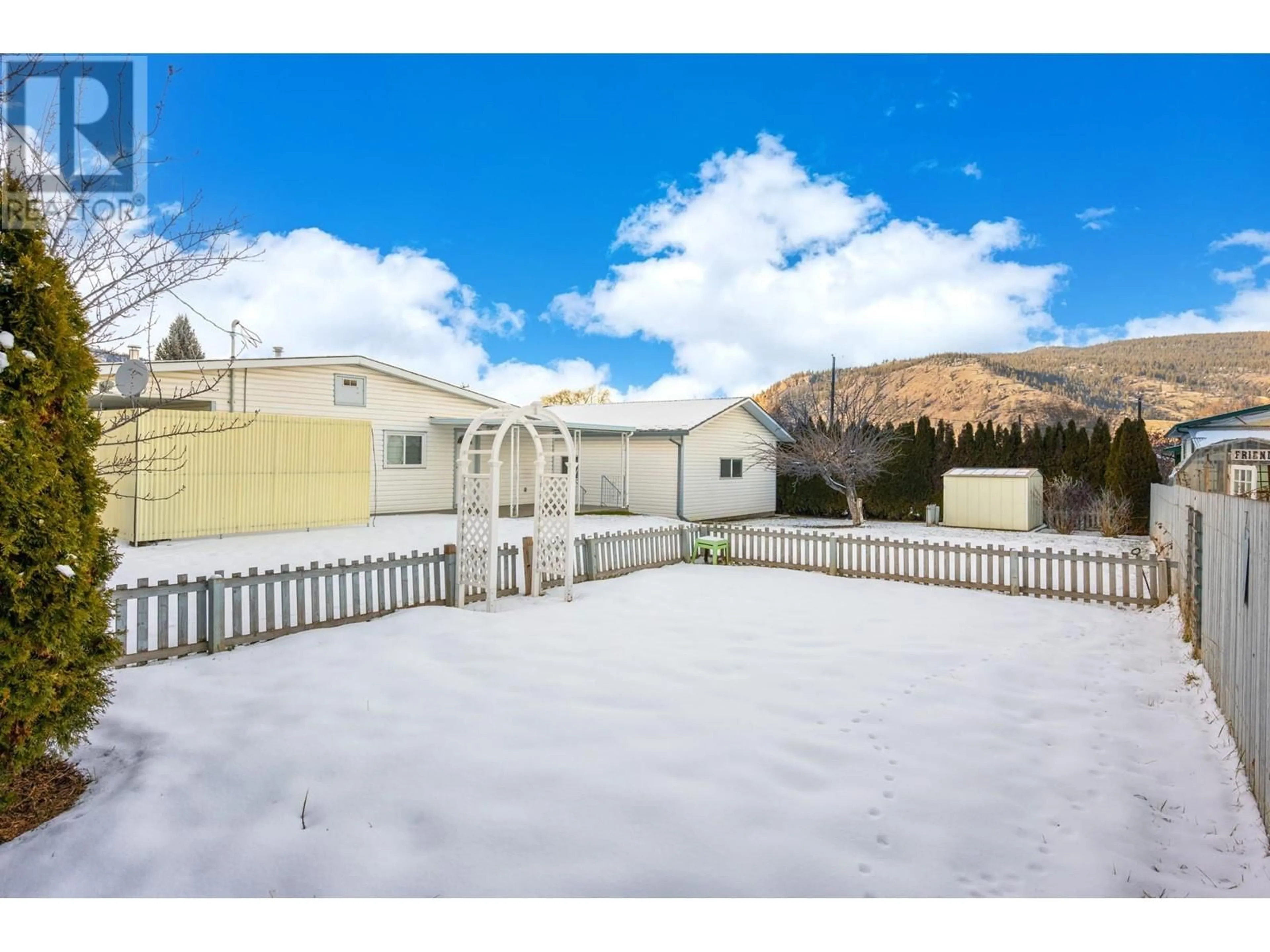 A pic from outside/outdoor area/front of a property/back of a property/a pic from drone, mountain view for 1590 FIR AVENUE, Merritt British Columbia V1K0C3