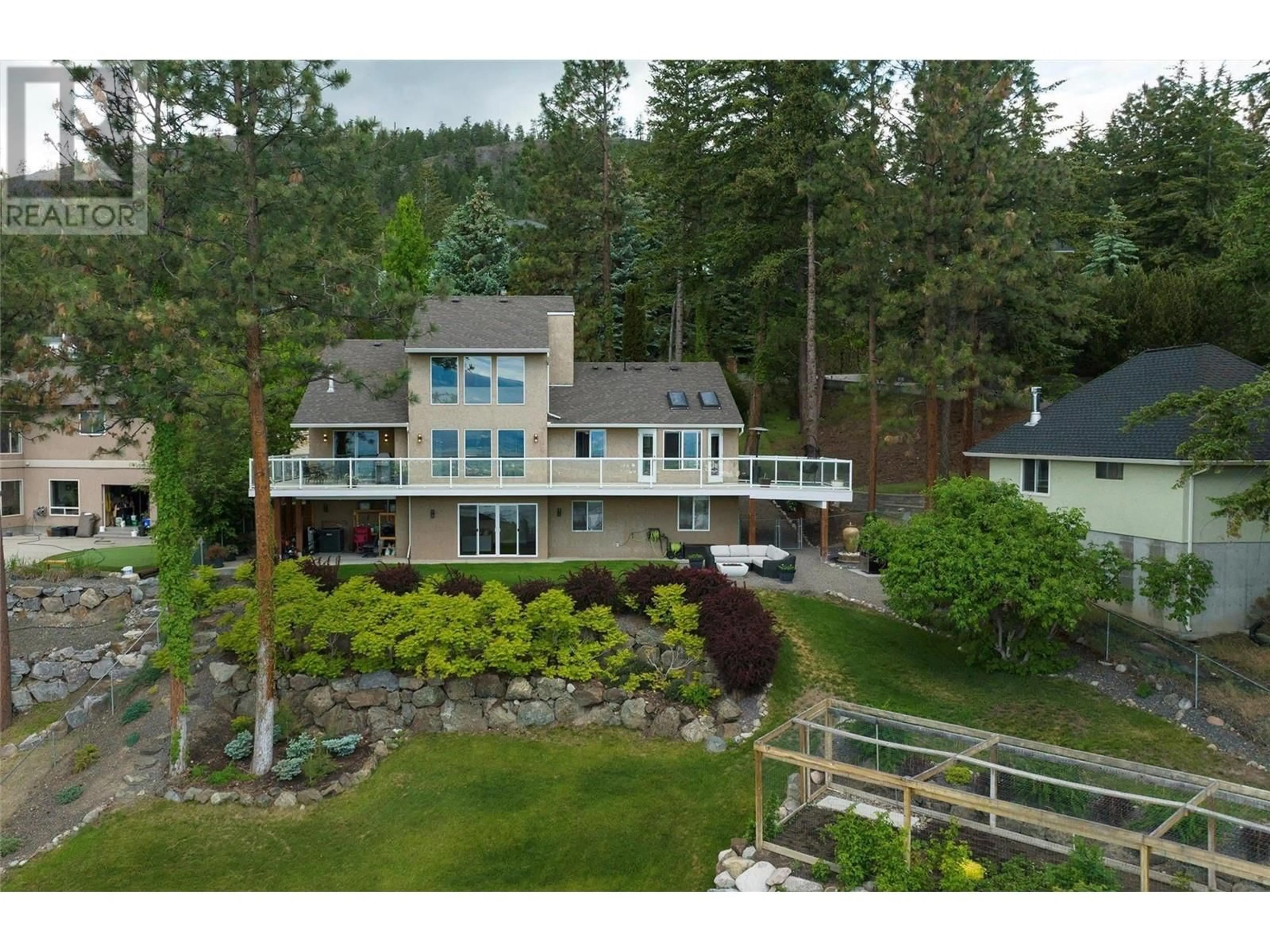 A pic from outside/outdoor area/front of a property/back of a property/a pic from drone, water/lake/river/ocean view for 943 Guest Road, West Kelowna British Columbia V1Z3L2