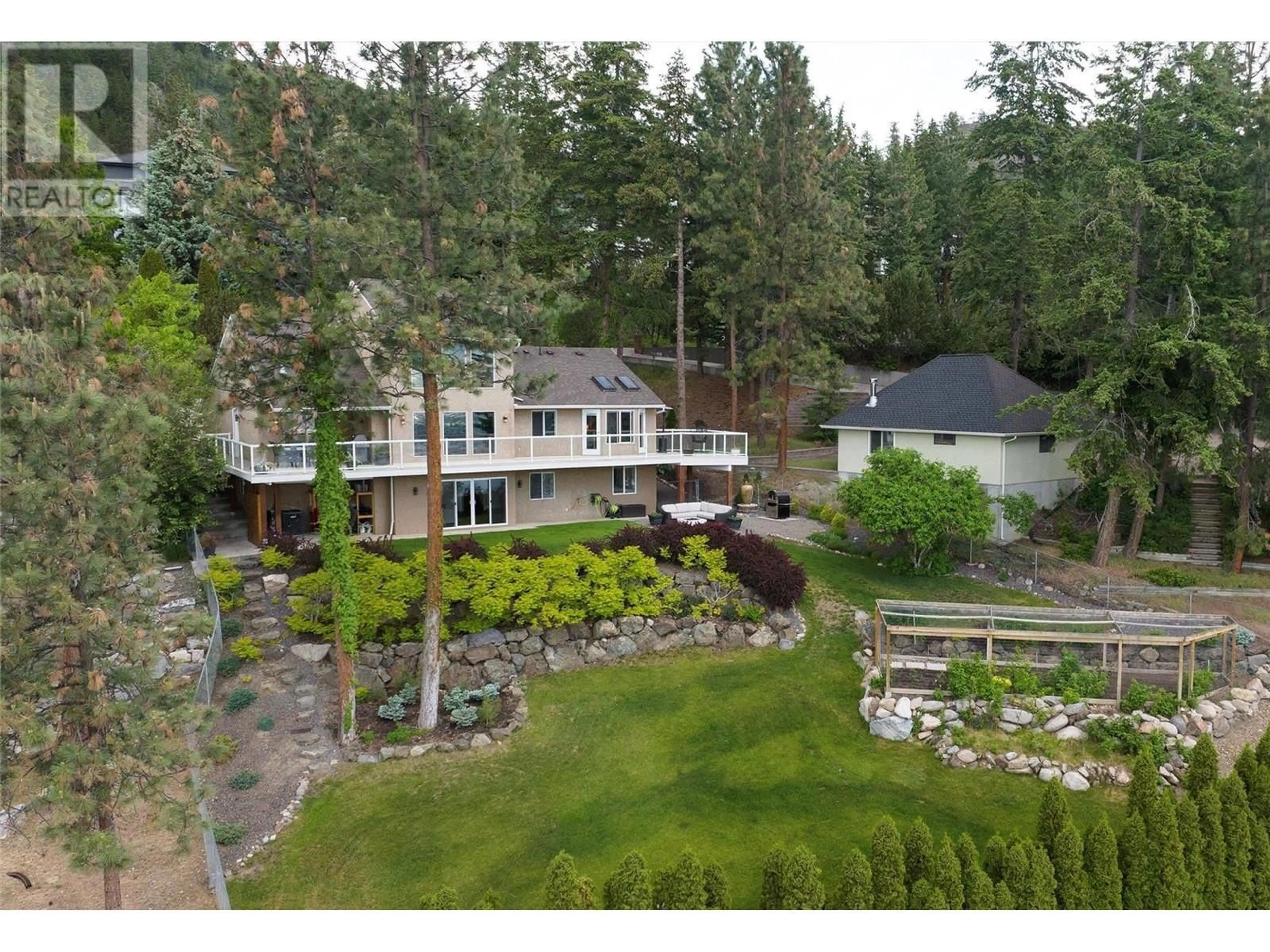 A pic from outside/outdoor area/front of a property/back of a property/a pic from drone, unknown for 943 Guest Road, West Kelowna British Columbia V1Z3L2