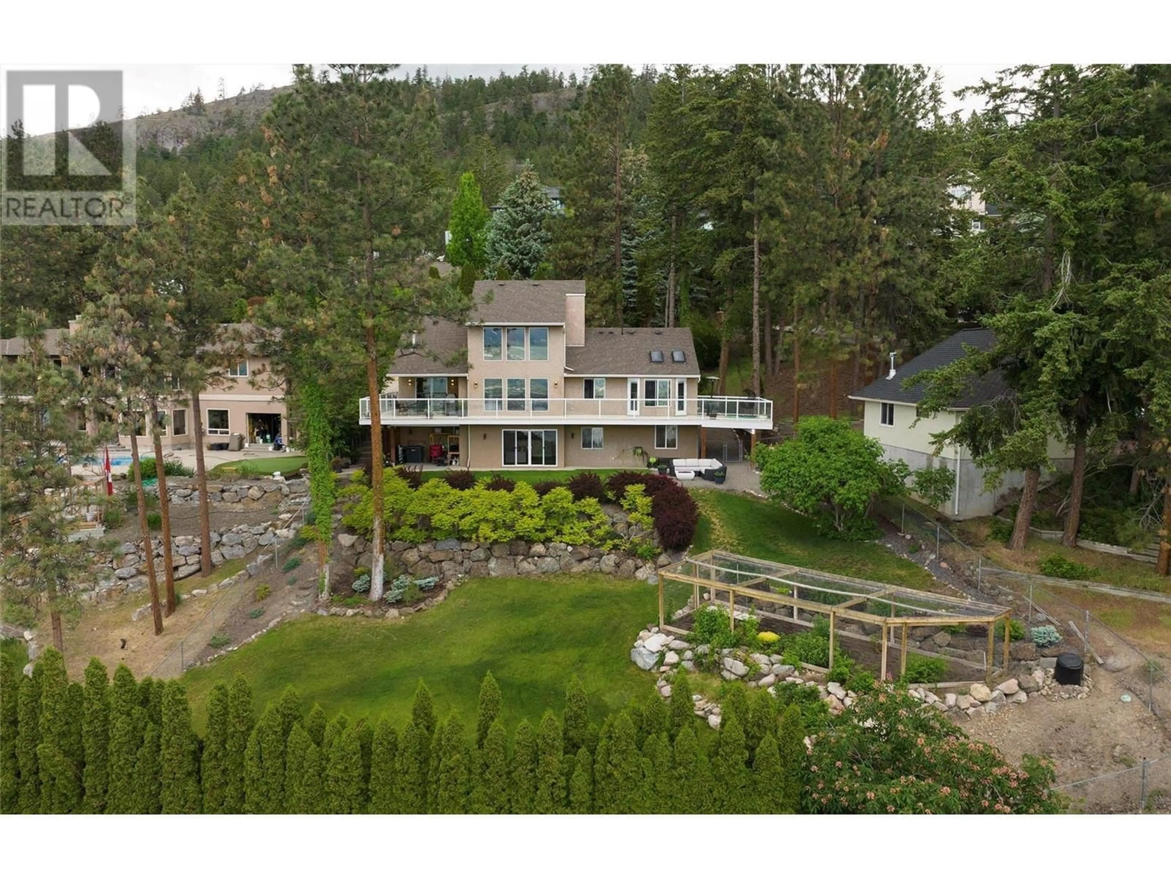 A pic from outside/outdoor area/front of a property/back of a property/a pic from drone, mountain view for 943 Guest Road, West Kelowna British Columbia V1Z3L2