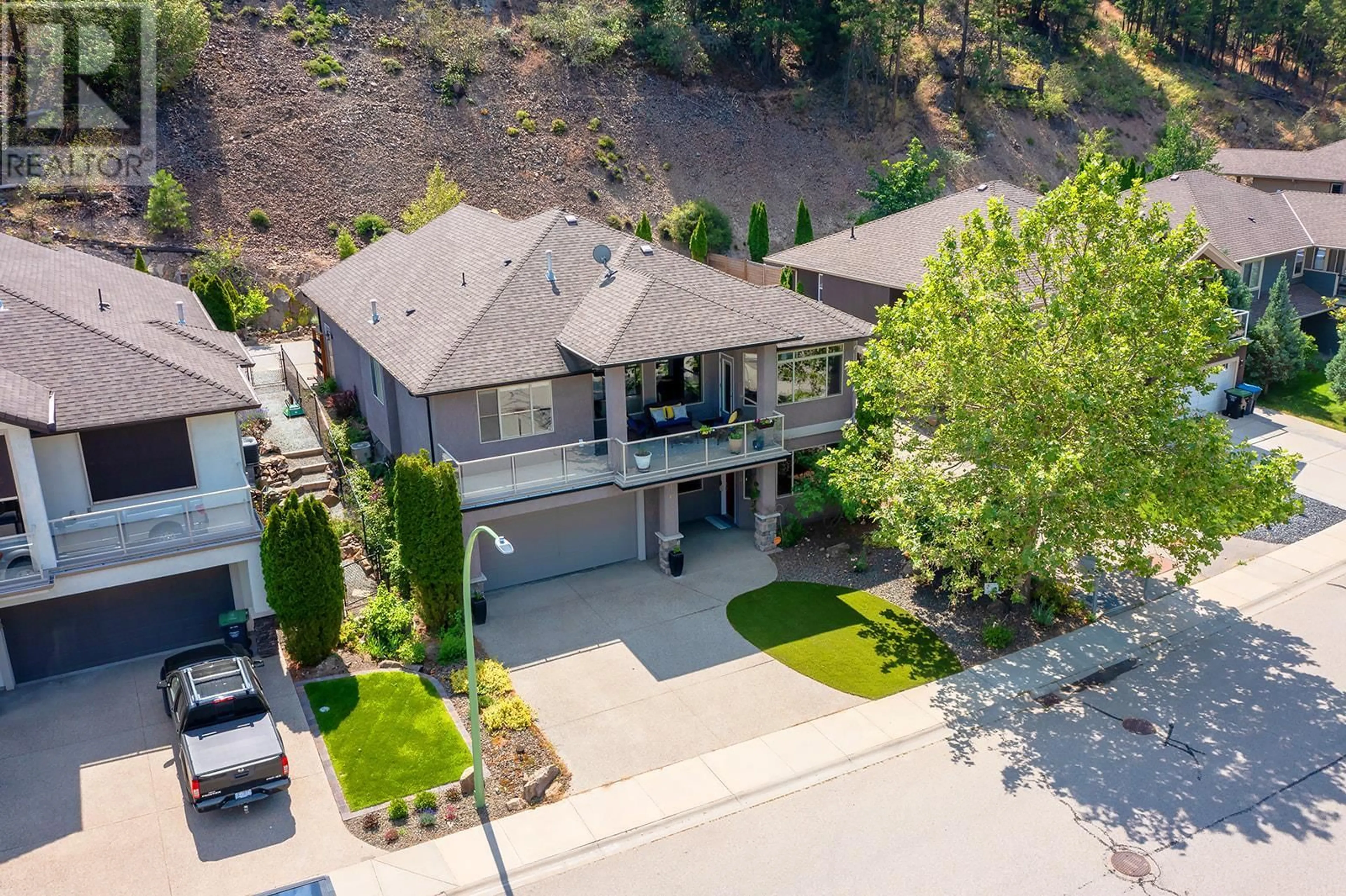 A pic from outside/outdoor area/front of a property/back of a property/a pic from drone, street for 1077 Peak Point Drive, West Kelowna British Columbia V1Z4B4