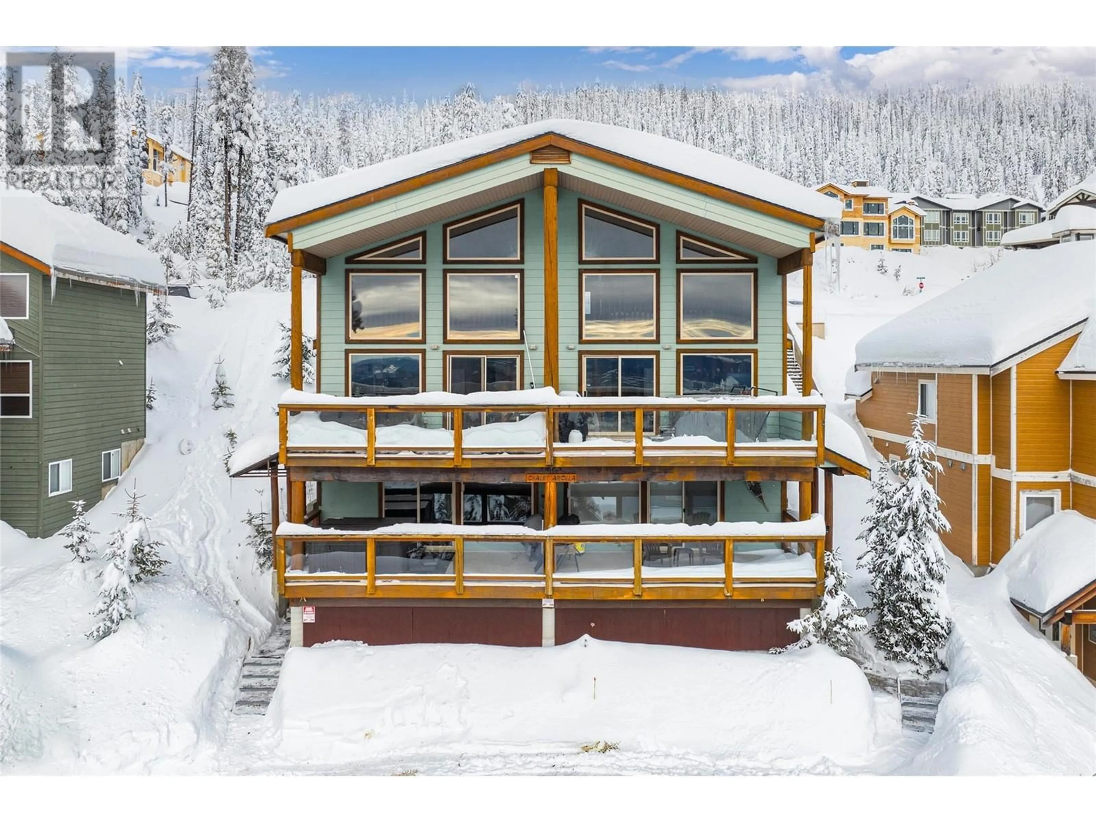 A pic from outside/outdoor area/front of a property/back of a property/a pic from drone, unknown for 5845 Snow Pines Crescent Unit# A, Big White British Columbia V1P1T4