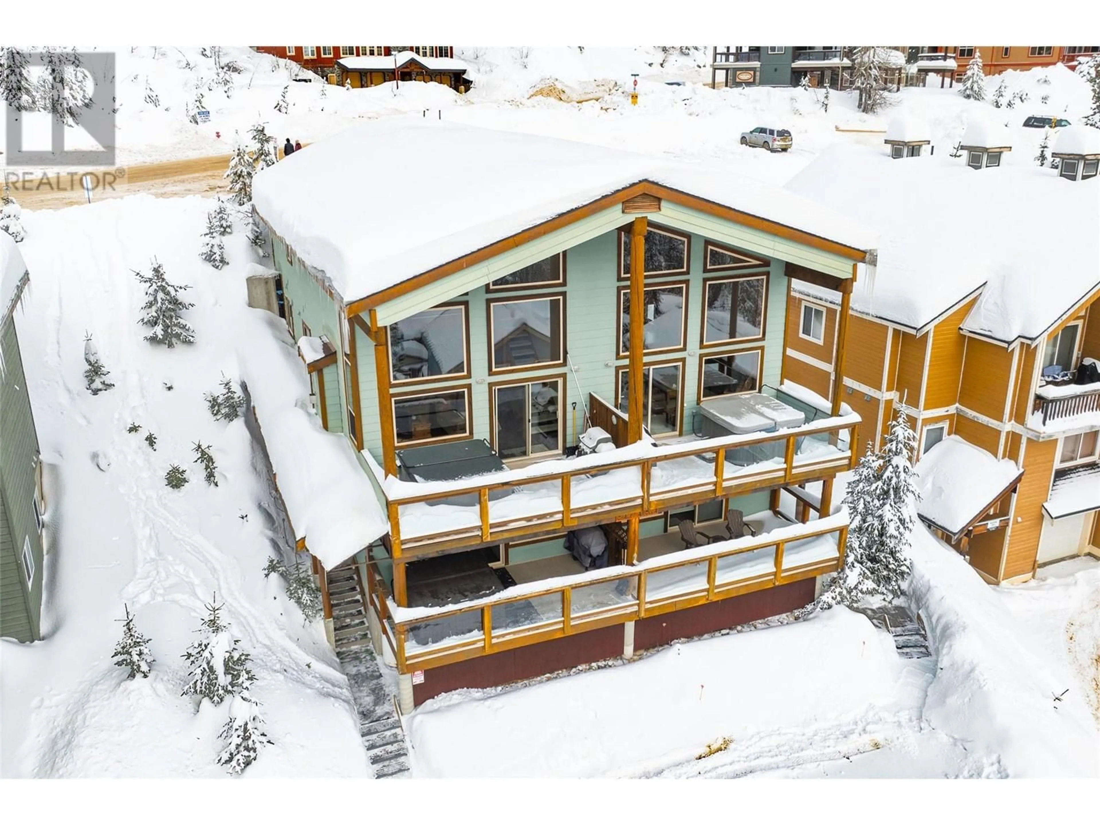 A pic from outside/outdoor area/front of a property/back of a property/a pic from drone, building for 5845 Snow Pines Crescent Unit# A, Big White British Columbia V1P1T4