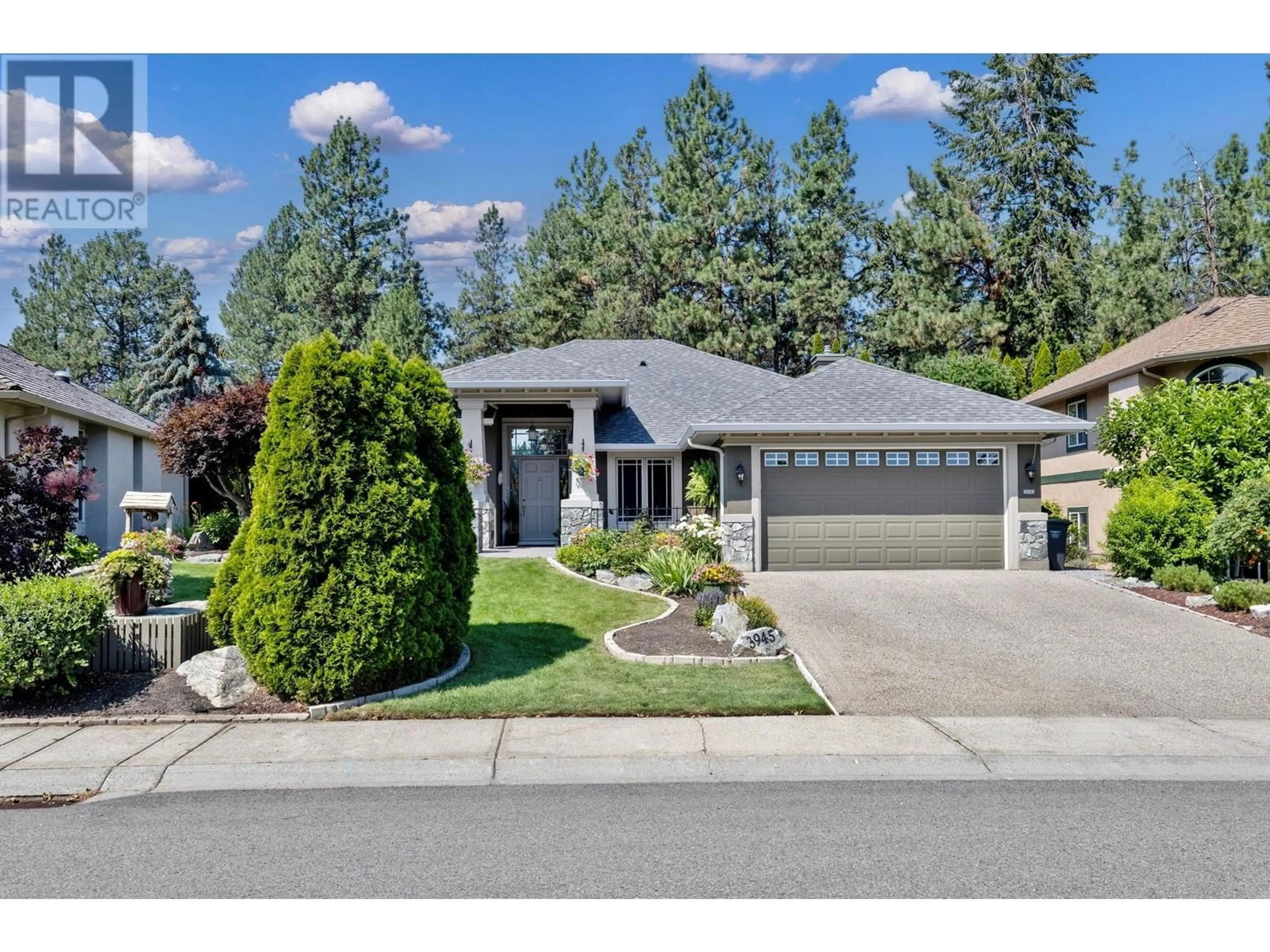 Home with vinyl exterior material, street for 3945 Gallaghers Circle, Kelowna British Columbia V1W3Z9