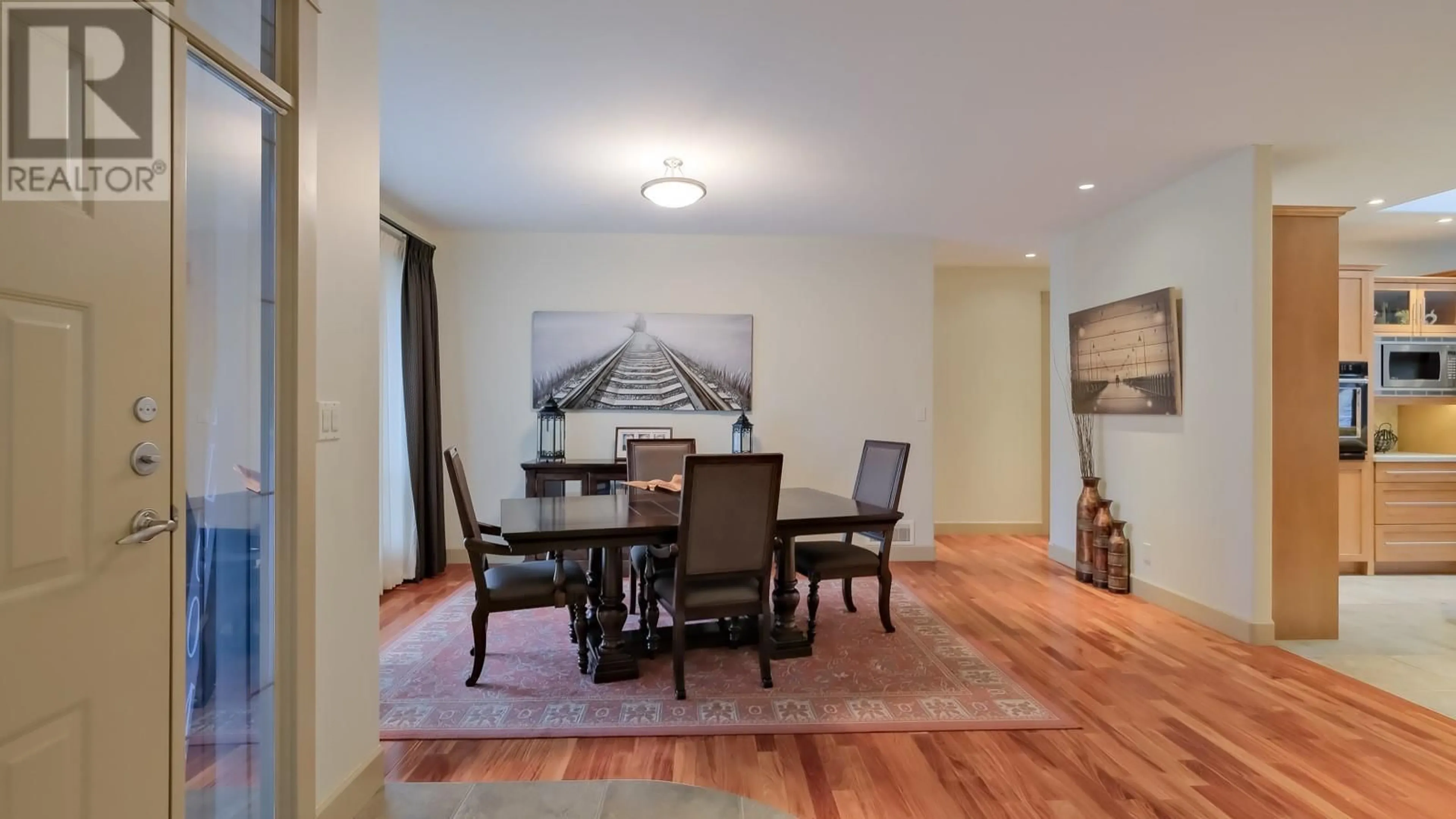 Dining room, wood/laminate floor for 3160 EVERGREEN Drive, Penticton British Columbia V2A9A9