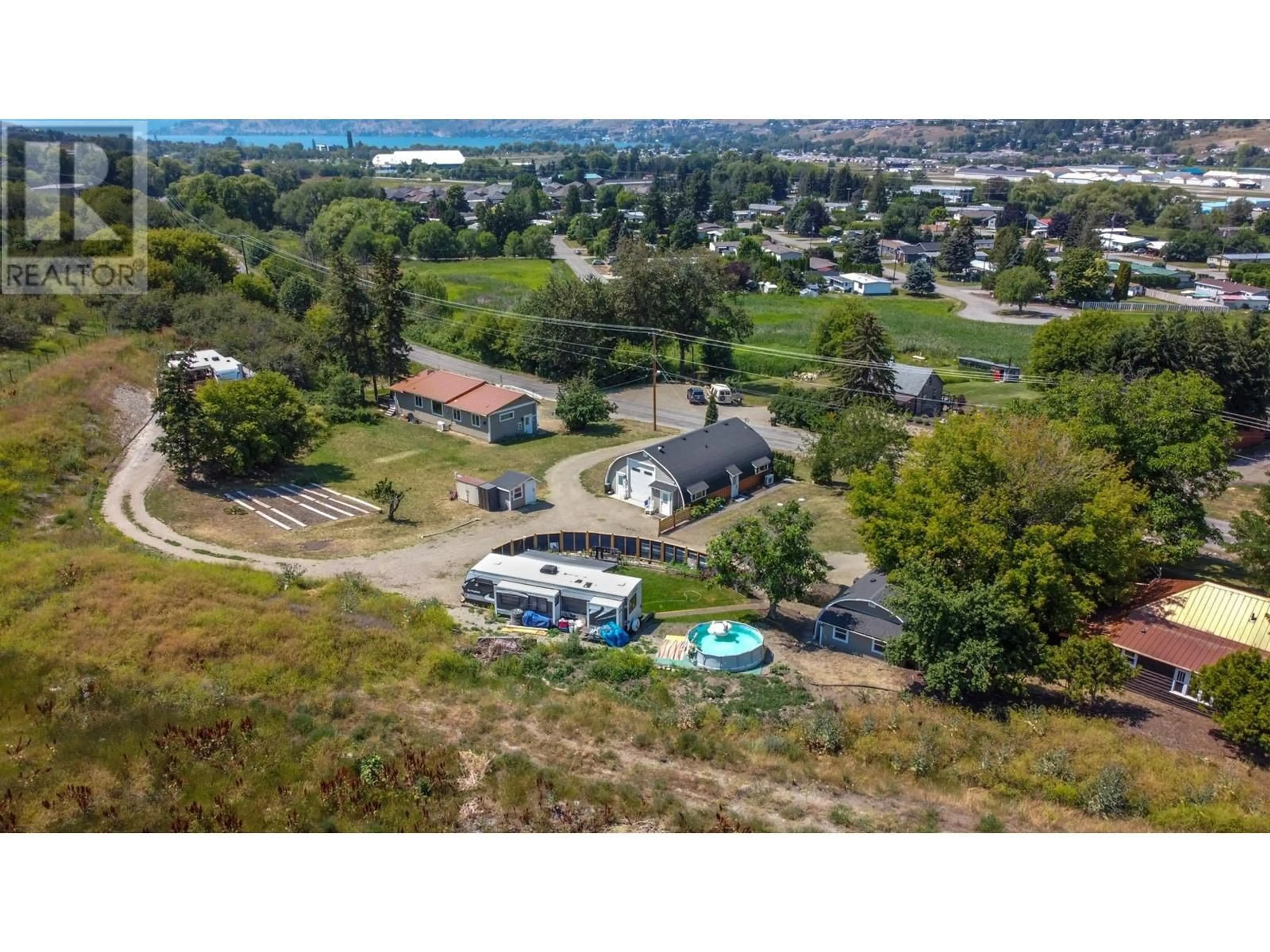 A pic from outside/outdoor area/front of a property/back of a property/a pic from drone, water/lake/river/ocean view for 6226 Okanagan Avenue, Vernon British Columbia V1H1M1