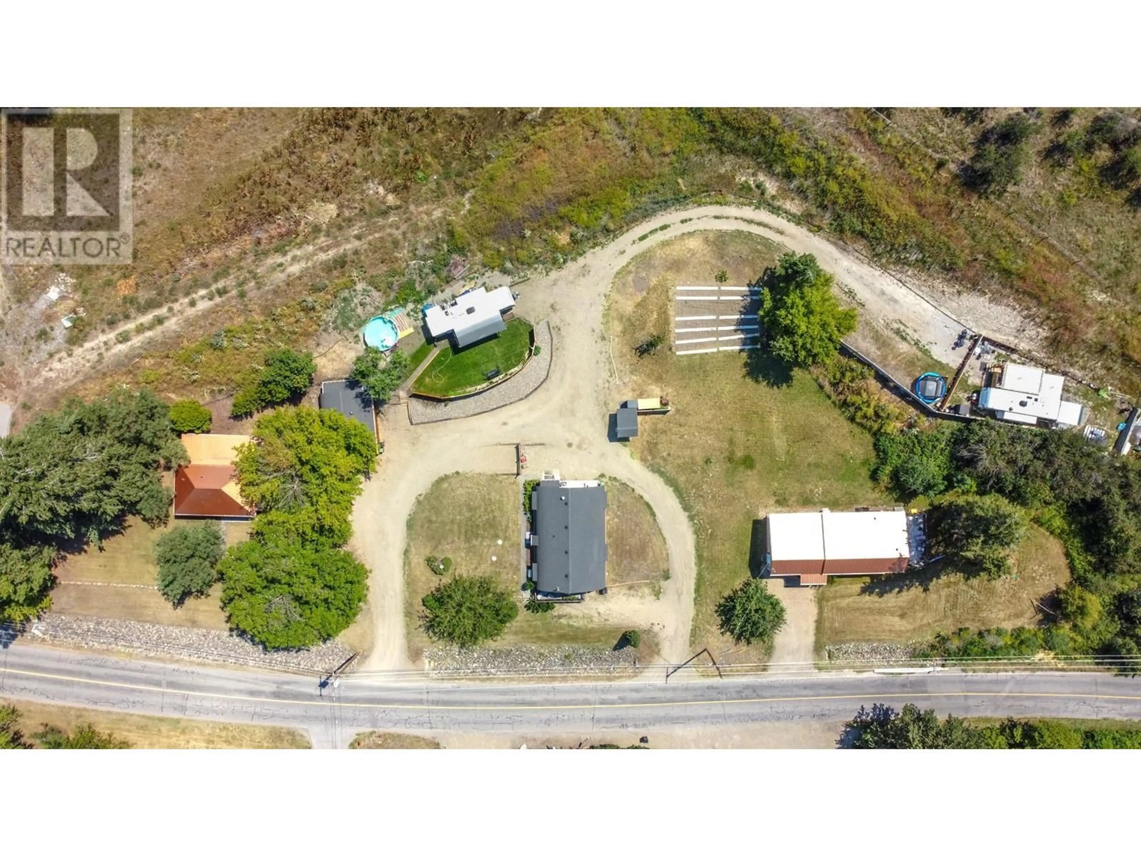 A pic from outside/outdoor area/front of a property/back of a property/a pic from drone, street for 6226 Okanagan Avenue, Vernon British Columbia V1H1M1