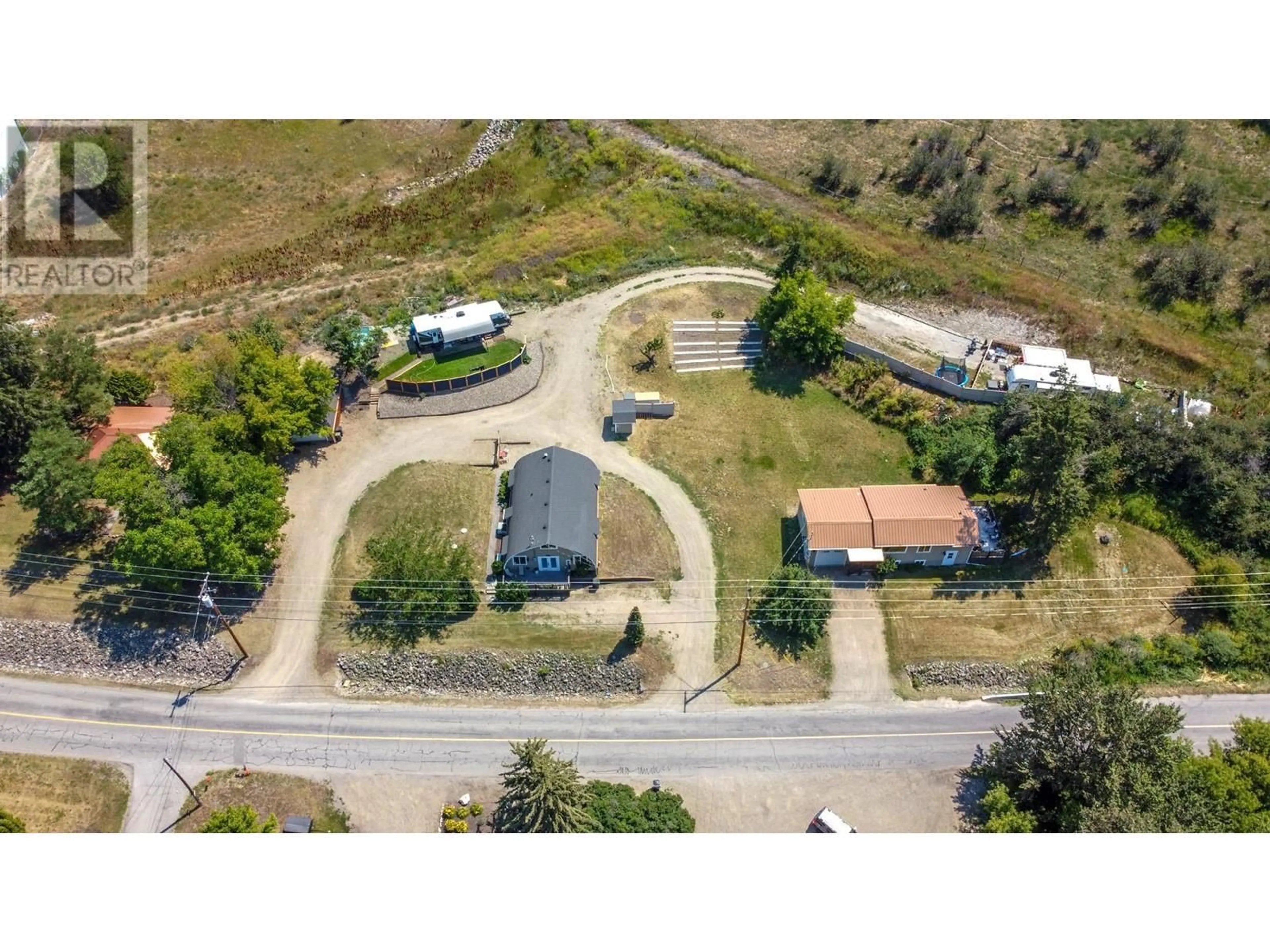 A pic from outside/outdoor area/front of a property/back of a property/a pic from drone, street for 6226 Okanagan Avenue, Vernon British Columbia V1H1M1